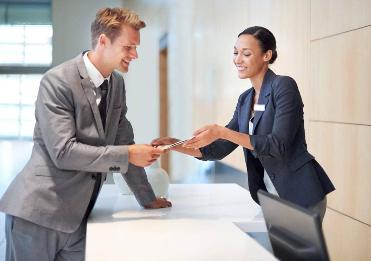 Concierge service area at 1535 Howe Vancouver by Onni showing professional front desk assistance and luxury hospitality-inspired resident experience at 1335 Howe Street in Downtown Vancouver.