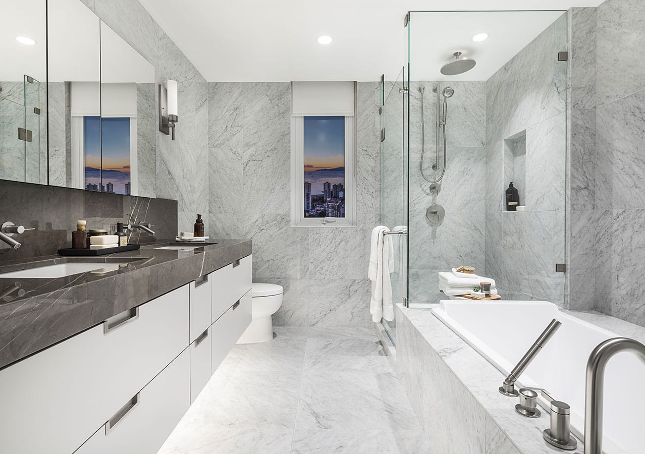 Luxury ensuite bathroom at 1535 Howe Vancouver featuring marble surfaces, dual vanity, frameless shower, soaking tub, and Downtown Vancouver views from 1335 Howe Street.