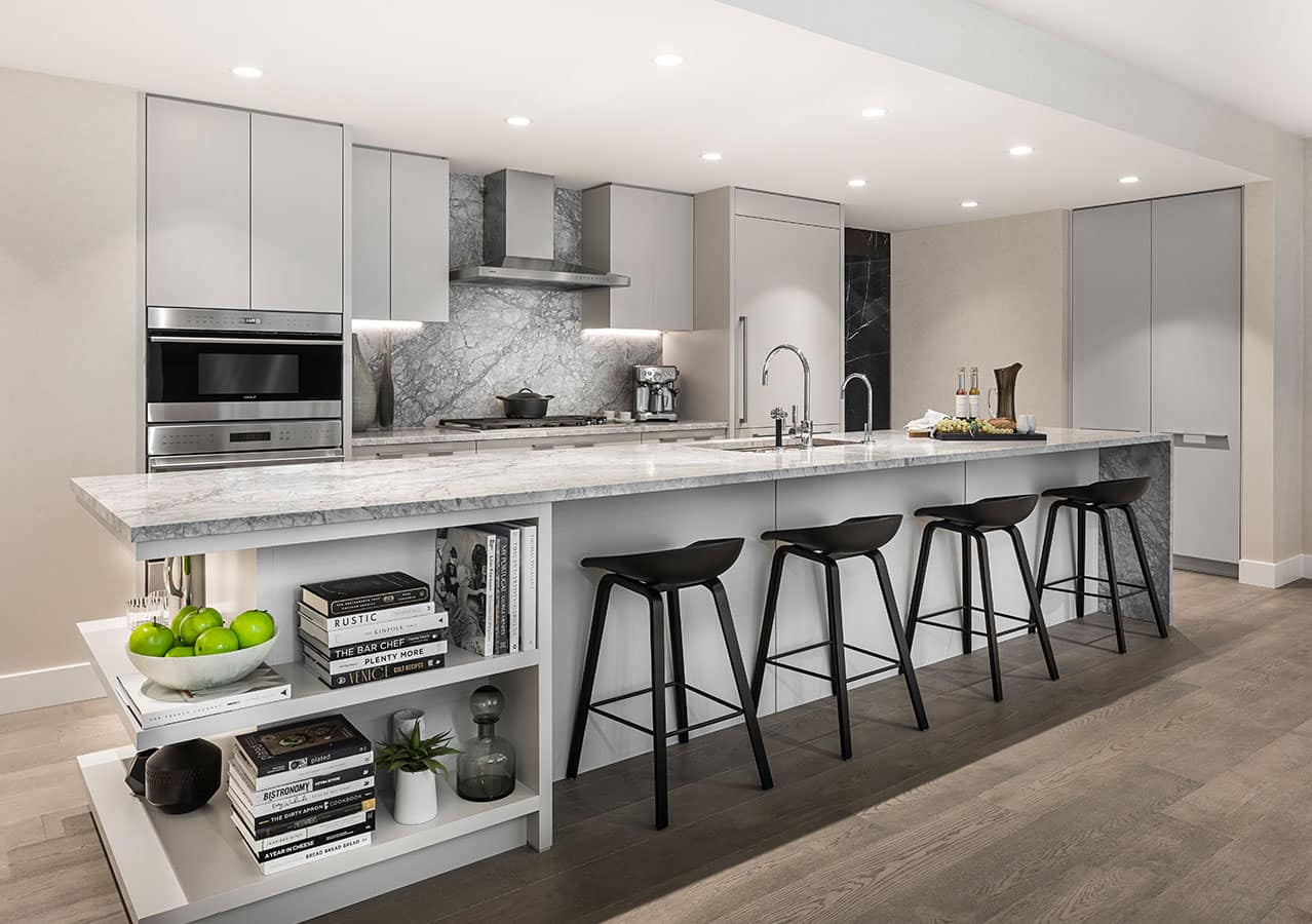 Bright contemporary kitchen at 1535 Howe Vancouver by Onni featuring a marble waterfall island, integrated storage shelving, premium appliances, and elegant modern finishes at 1335 Howe Street Downtown Vancouver.