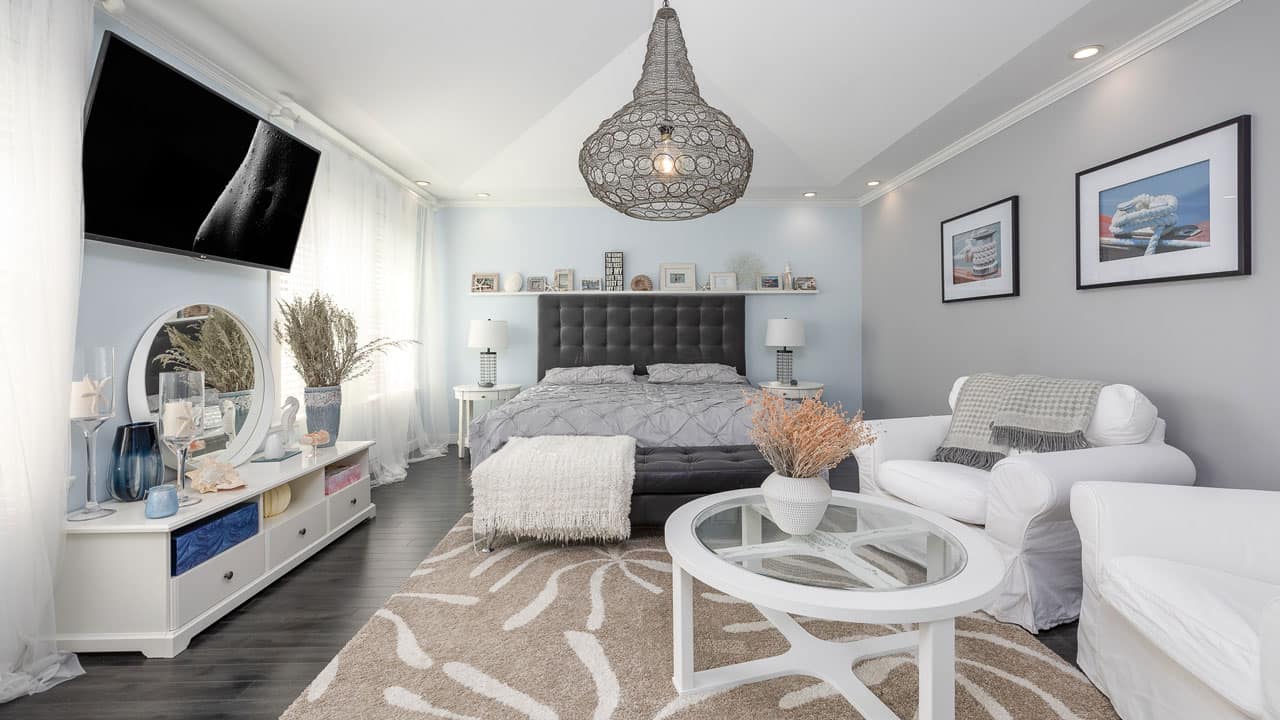 First time home buyer BC guide: bright, staged bedroom in a move-in ready Metro Vancouver home