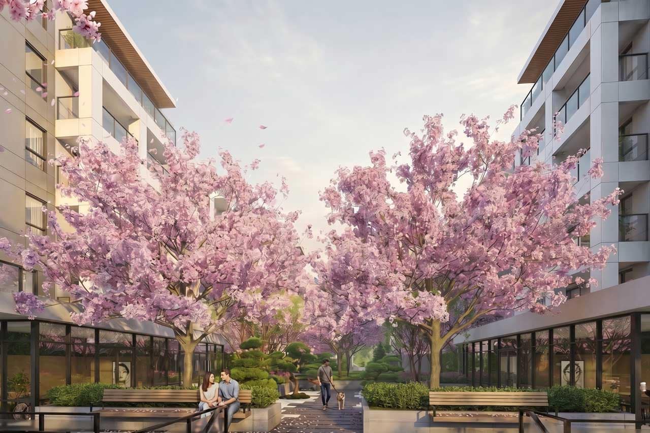 Landscaped pedestrian plaza at Kamilia Langley in Downtown Langley, developed by Kingdom Property Investment Ltd. at 20675 Eastleigh Crescent, featuring flowering cherry blossom trees, benches, retail-style storefronts, and contemporary condo architecture.