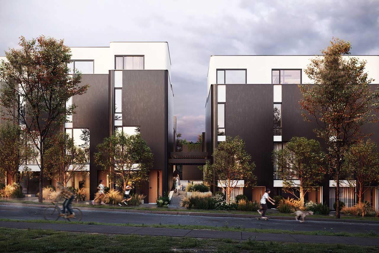 Street-level architectural rendering of The Cut Vancouver, a modern townhome development by Fabric Living located at 2835 Kamloops Street in Vancouver. The image showcases contemporary multi-level residences with contrasting dark metal cladding, large windows, landscaped pathways, mature trees, and pedestrian-friendly outdoor spaces. Residents are shown walking, cycling, and enjoying the community environment, highlighting the design-forward character and urban lifestyle offered by The Cut Vancouver near Trout Lake and East Vancouver amenities.