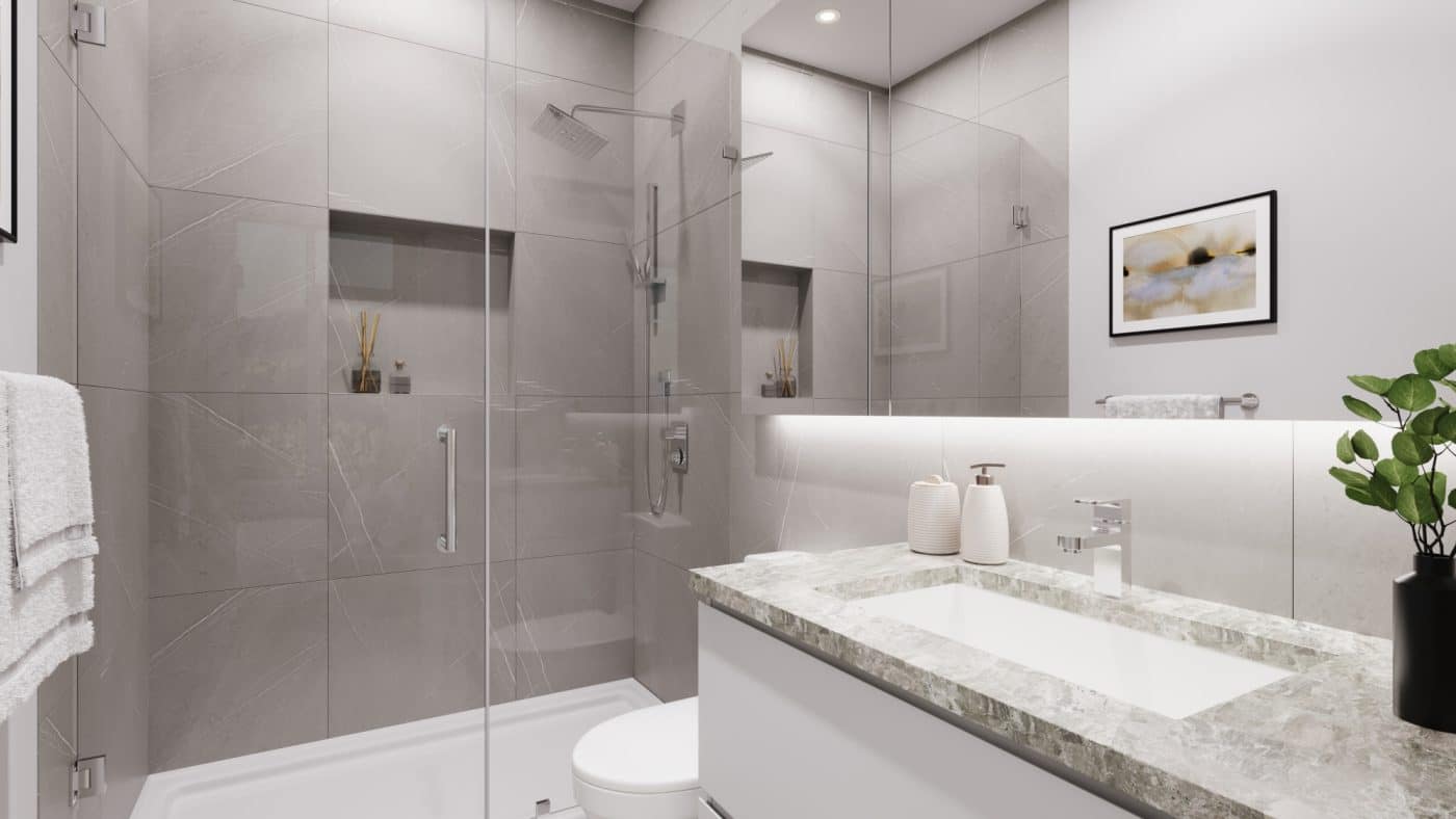 Contemporary bathroom interior at Pine & Glen Coquitlam featuring large-format porcelain tile, frameless glass shower, stone-inspired vanity, and modern fixtures by Onni Group at 1175 Pinetree Way.