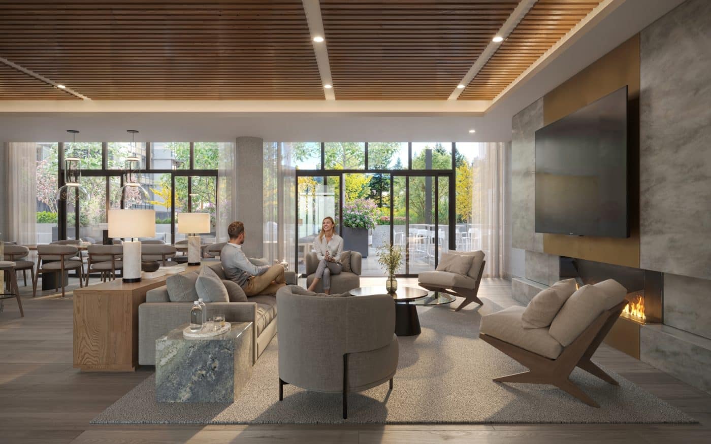 Elegant fireside lounge at Pine & Glen Coquitlam featuring designer furnishings, fireplace, large windows, and sophisticated gathering spaces within the Onni Group development at 1175 Pinetree Way.