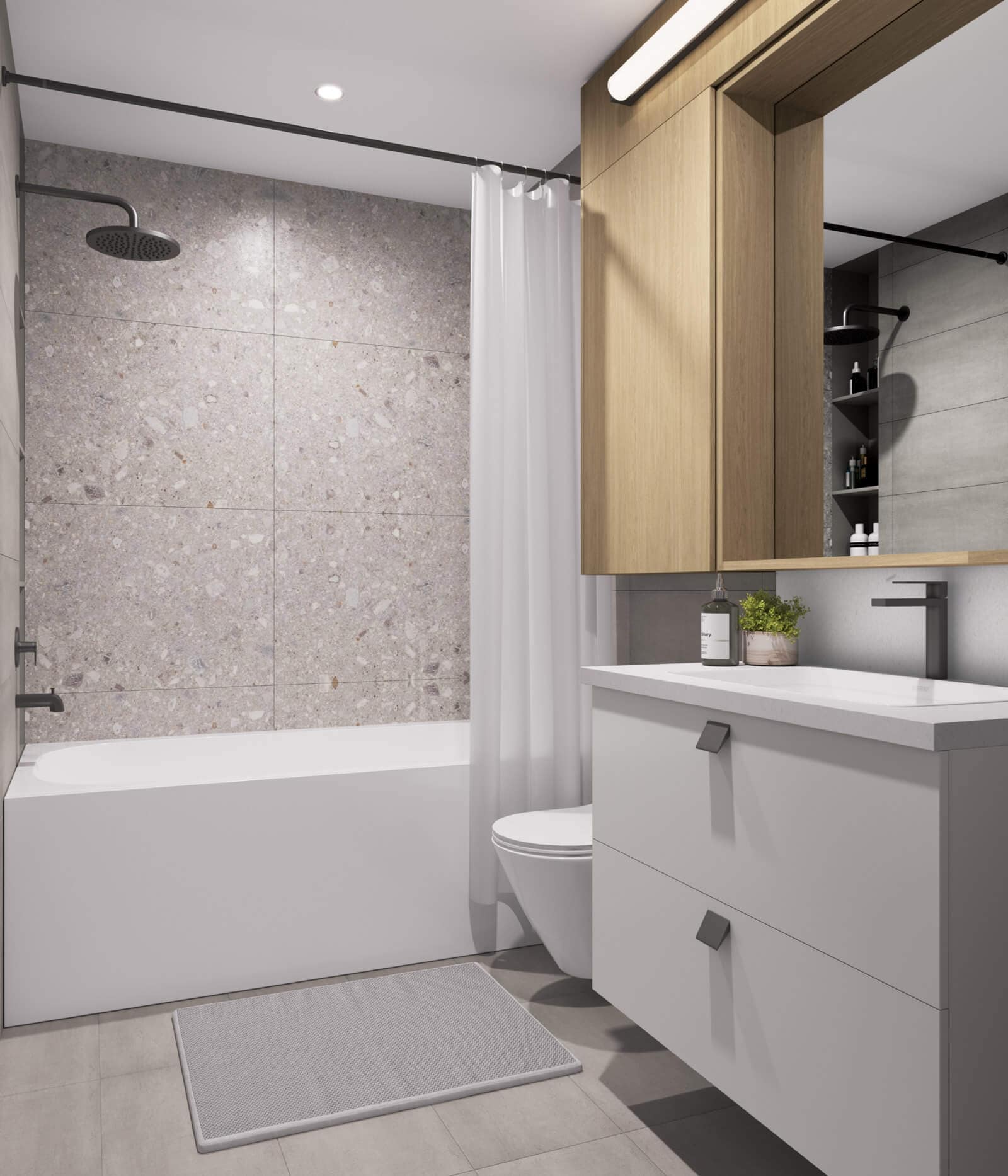 Bright bathroom finish package at Be W 49th Vancouver with terrazzo-style wall tile, light vanity cabinetry, matte black fixtures, and modern tub-shower design in the Oakridge development by Modella Developments.