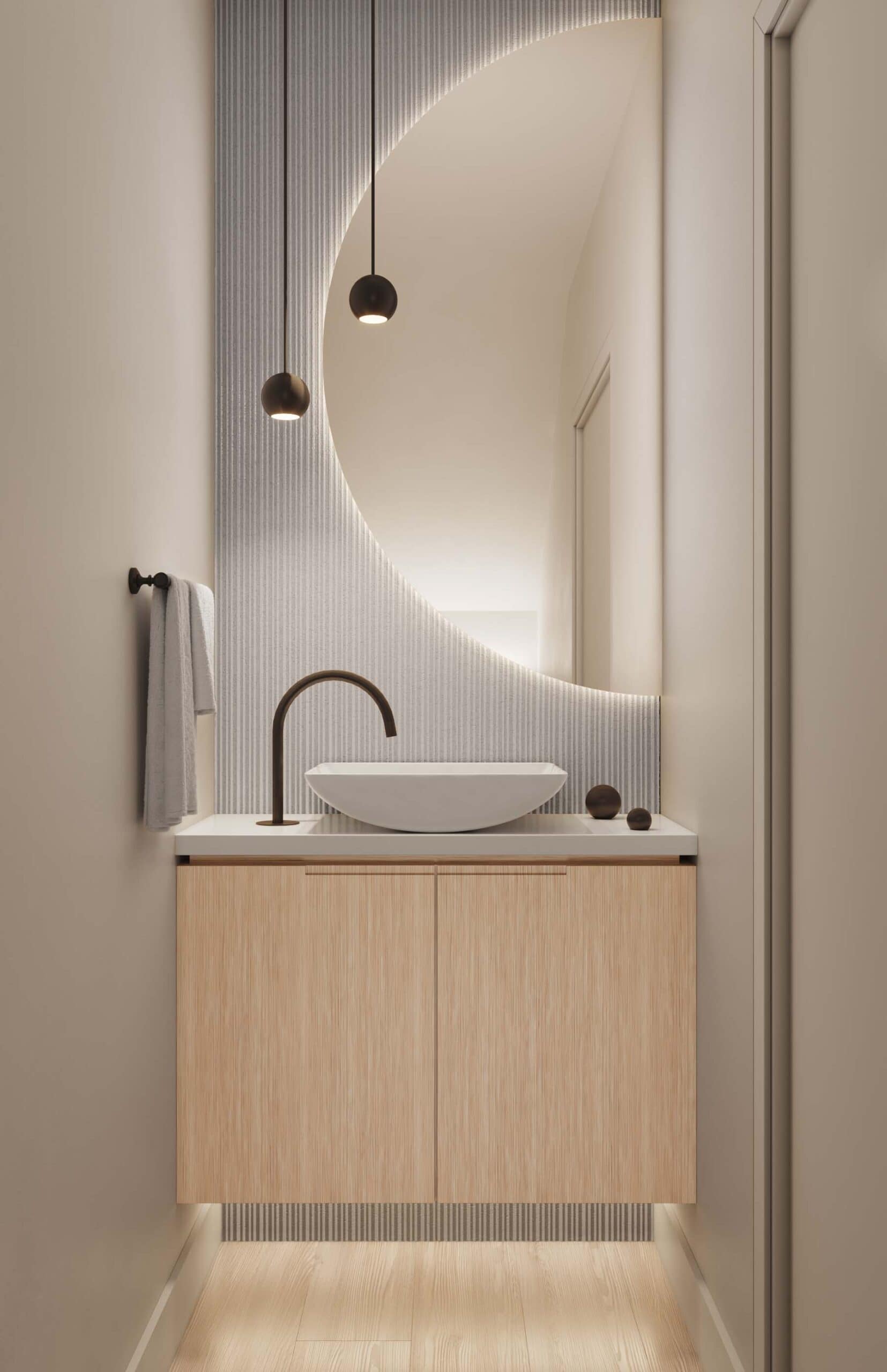 Powder room at Nolia Vancouver with light wood vanity and circular mirror