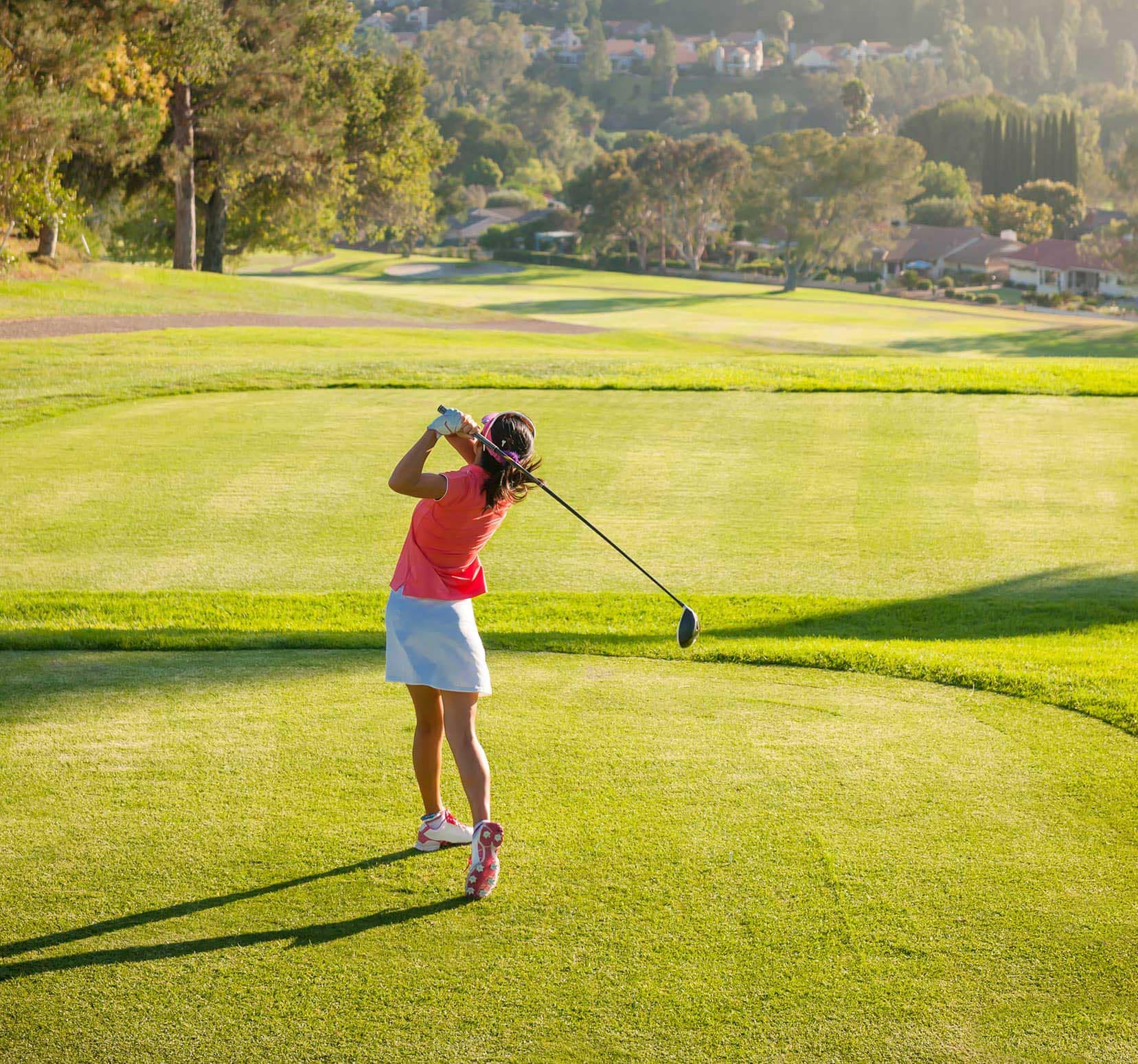 Golfer enjoying a nearby golf course close to West58 Vancouver by Azora Group, highlighting recreational opportunities near 7425 Granville Street.