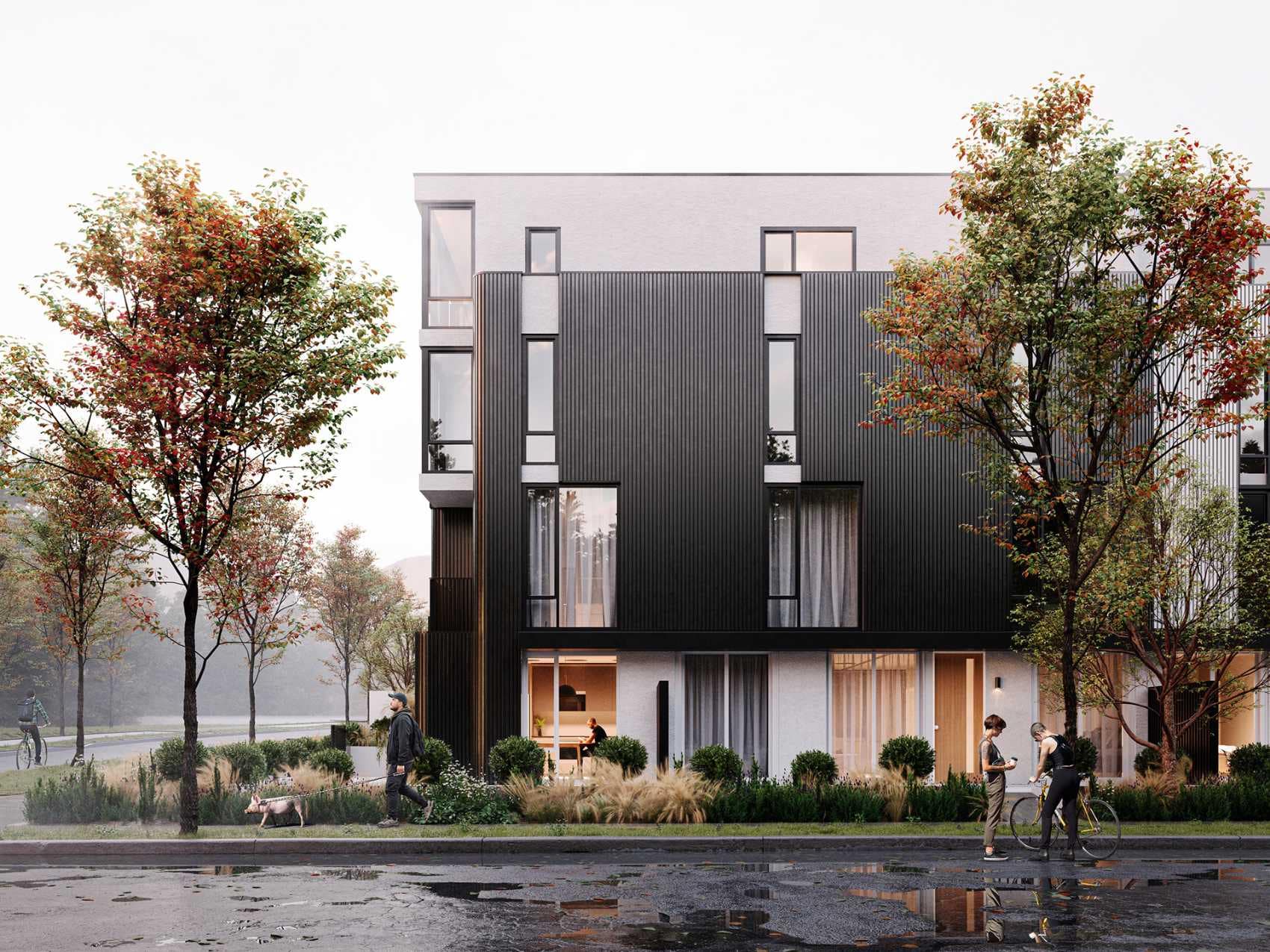 Townhome exterior at The Cut East Vancouver with modern black cladding and landscaped entry.