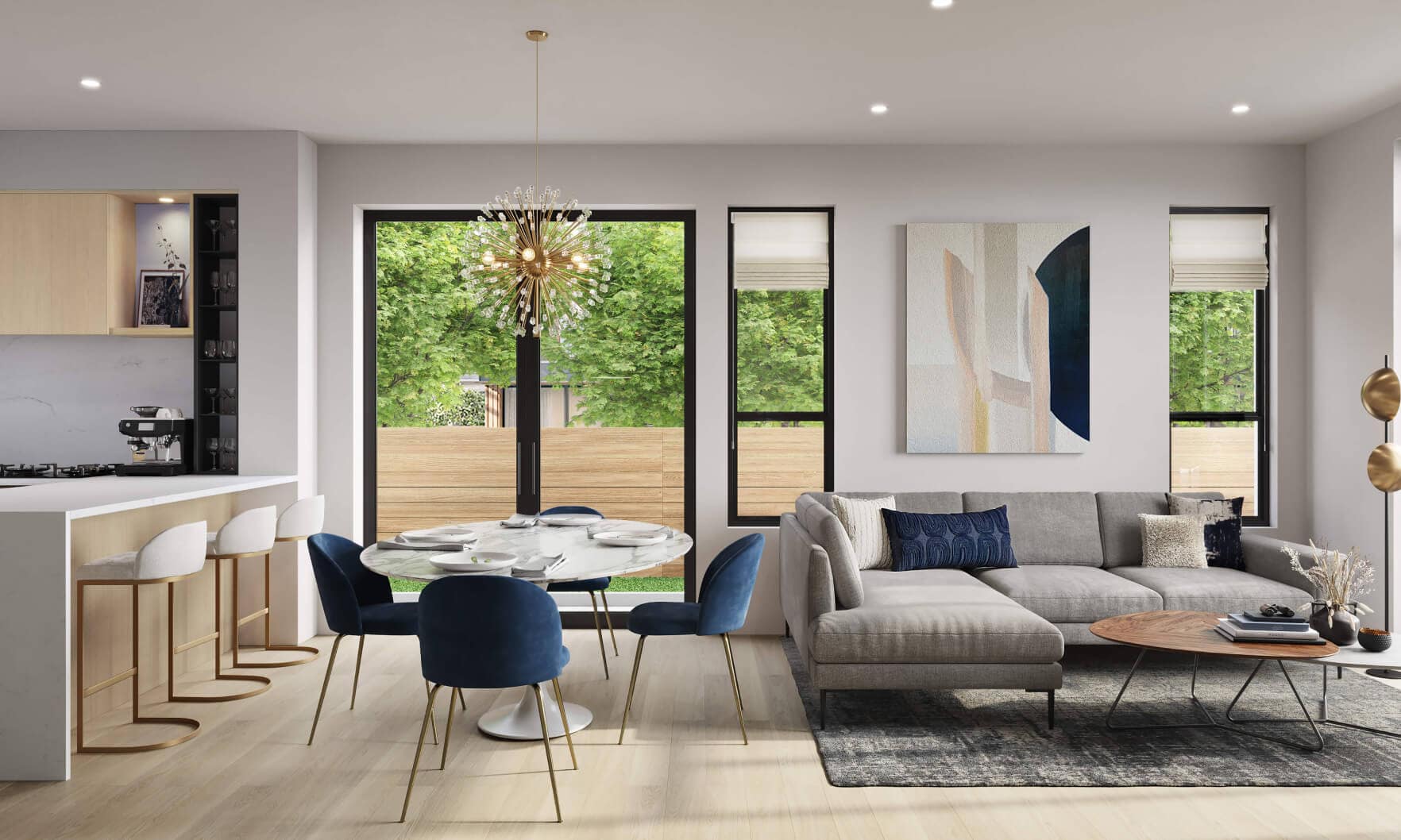Open living and dining area inside Be W 49th Vancouver featuring oversized patio doors, contemporary furnishings, natural light, and seamless indoor-outdoor flow in the Oakridge townhouse community by Modella Developments.