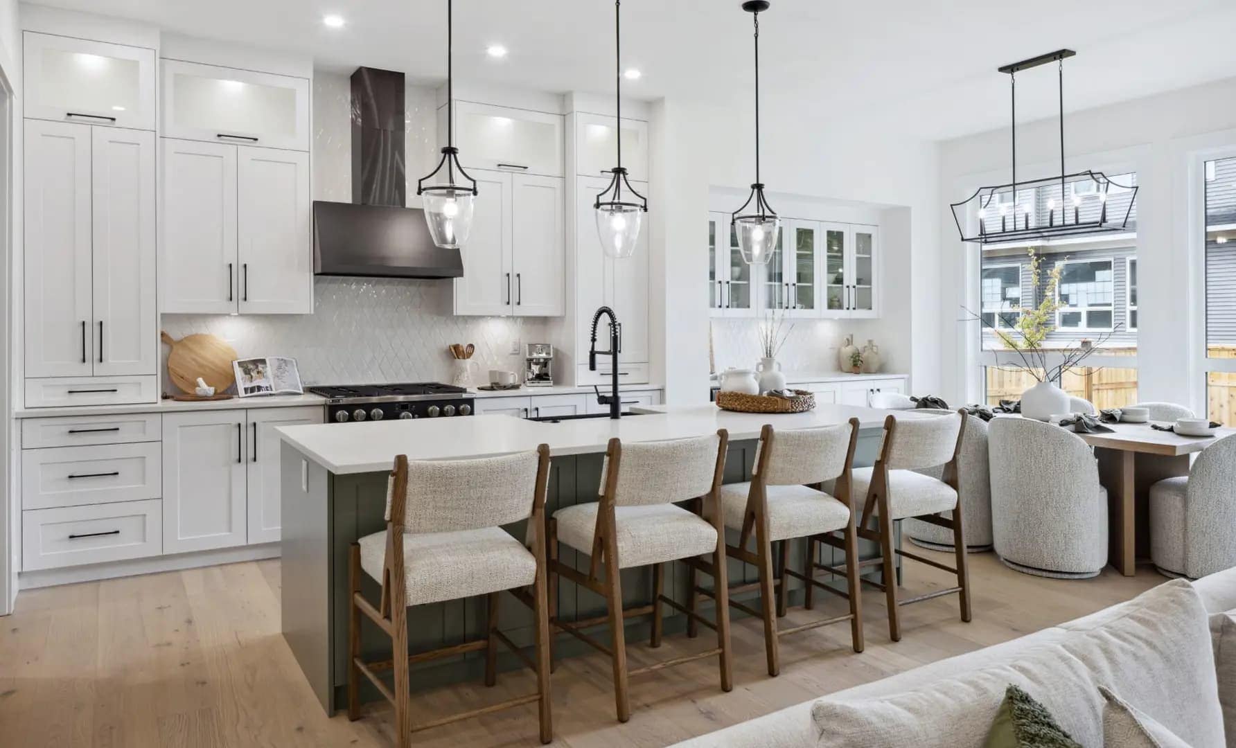 Spacious family kitchen at Brookswood Estates Langley by Foxridge Homes featuring large island seating, custom lighting, and modern open-concept design.
