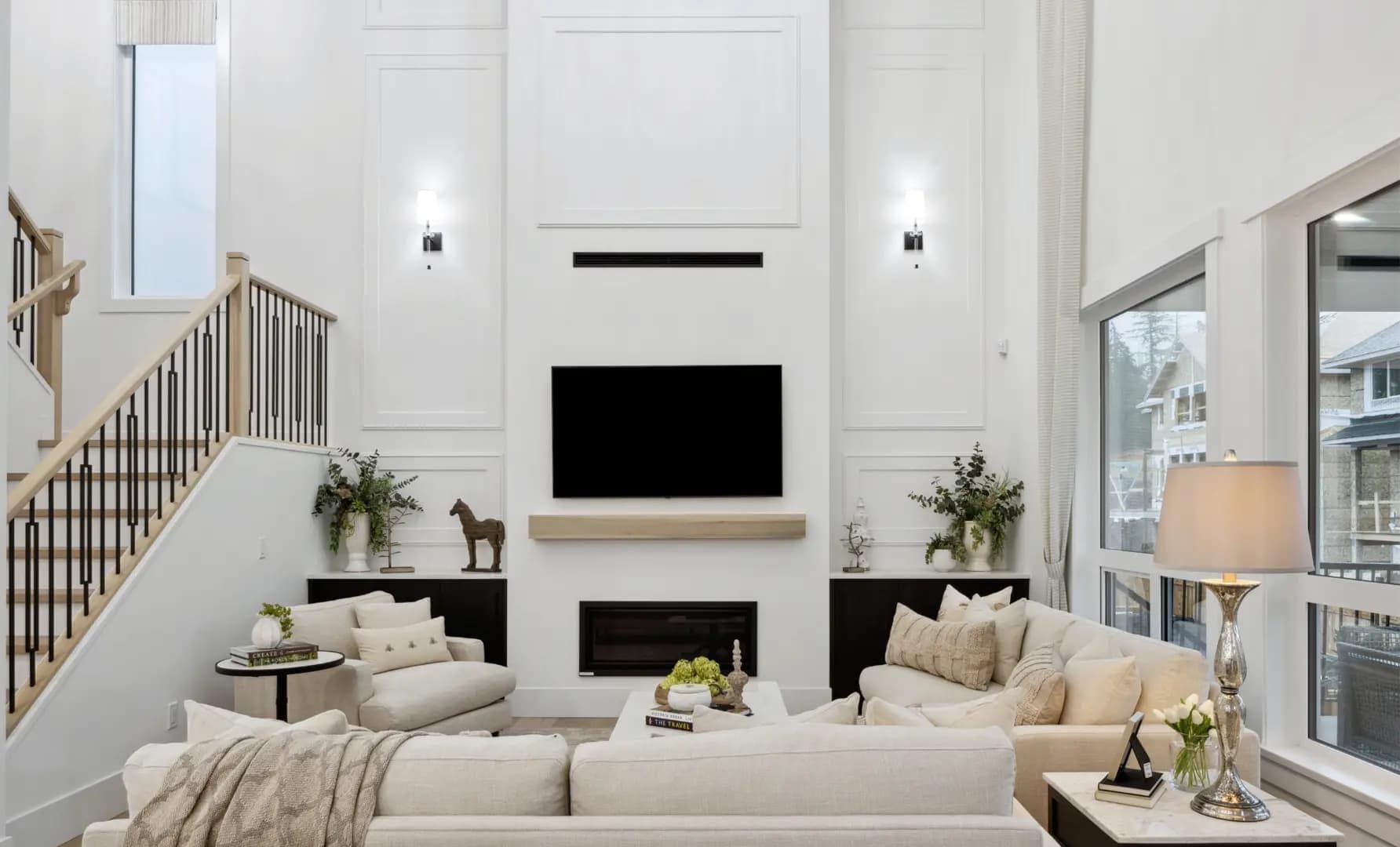 Bright great room at Brookswood Estates Langley by Foxridge Homes with soaring ceilings, modern fireplace, oversized windows, and open-concept living design.