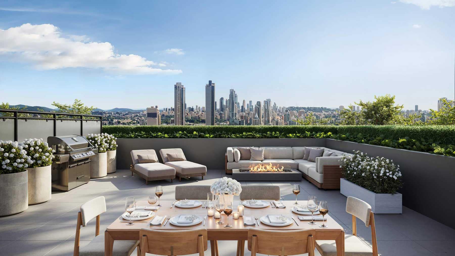 Outdoor rooftop terrace at Centrale Burnaby with lounge seating, fire table, dining area, barbecue, landscaped planters, and panoramic skyline views from Burnaby’s Capitol Hill neighbourhood.