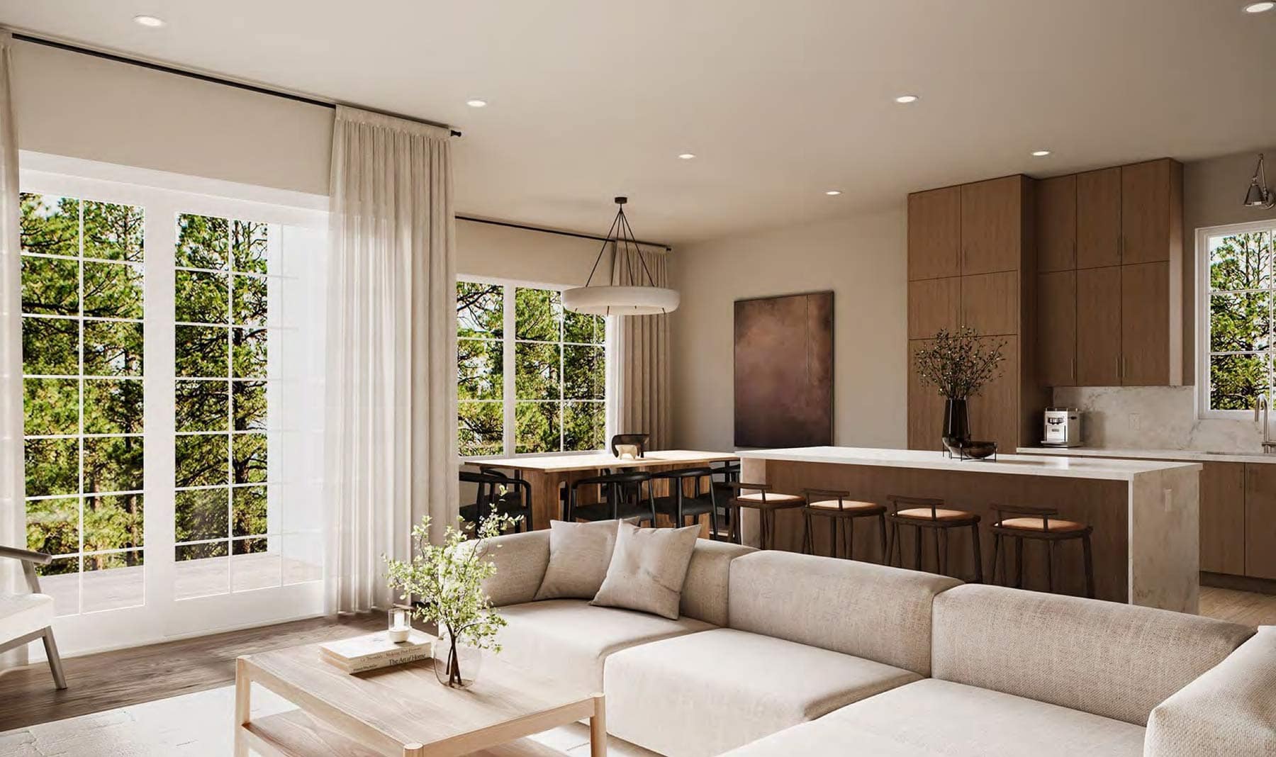 Open-concept living and kitchen area at 7609 Coldicutt Burnaby with large windows, island seating, and connected dining space at 7609 Coldicutt Street by ICON Projects & Costar Construction.