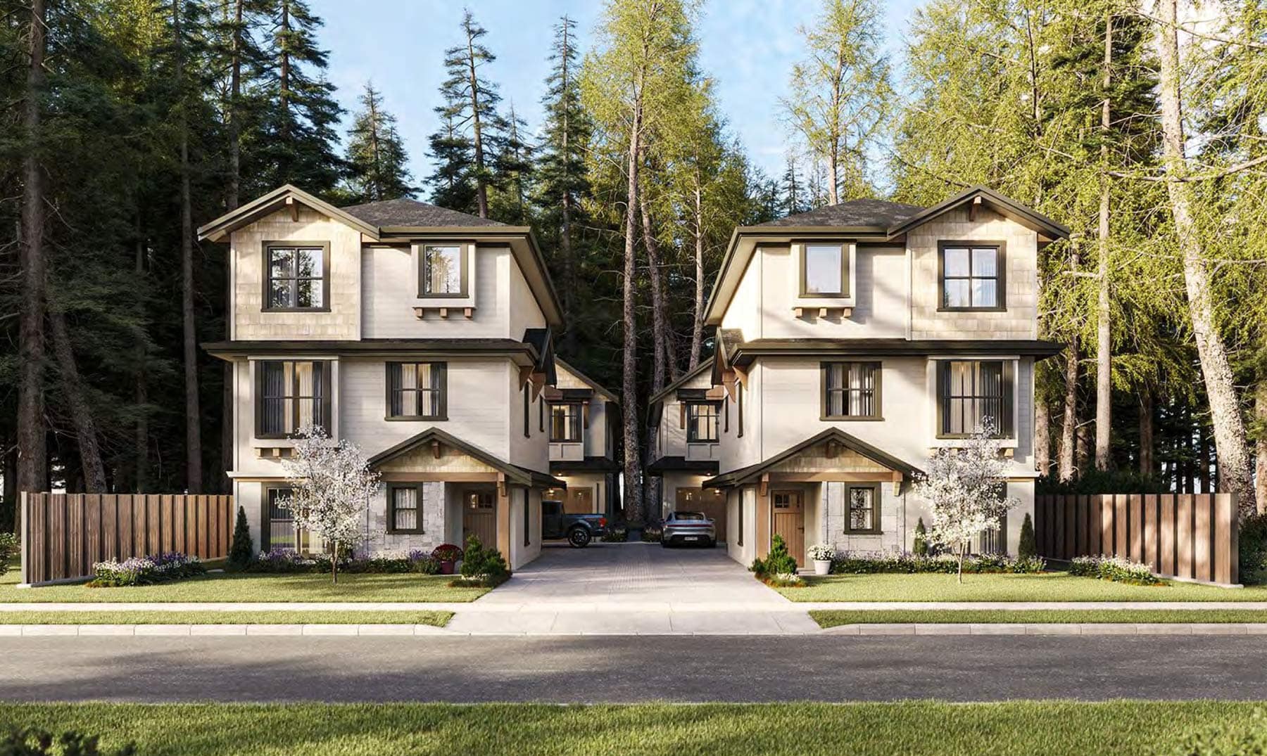 Front exterior view of 7609 Coldicutt Burnaby showing symmetrical detached homes, shared driveway, and landscaped yards at 7609 Coldicutt Street in The Crest by ICON Projects & Costar Construction.