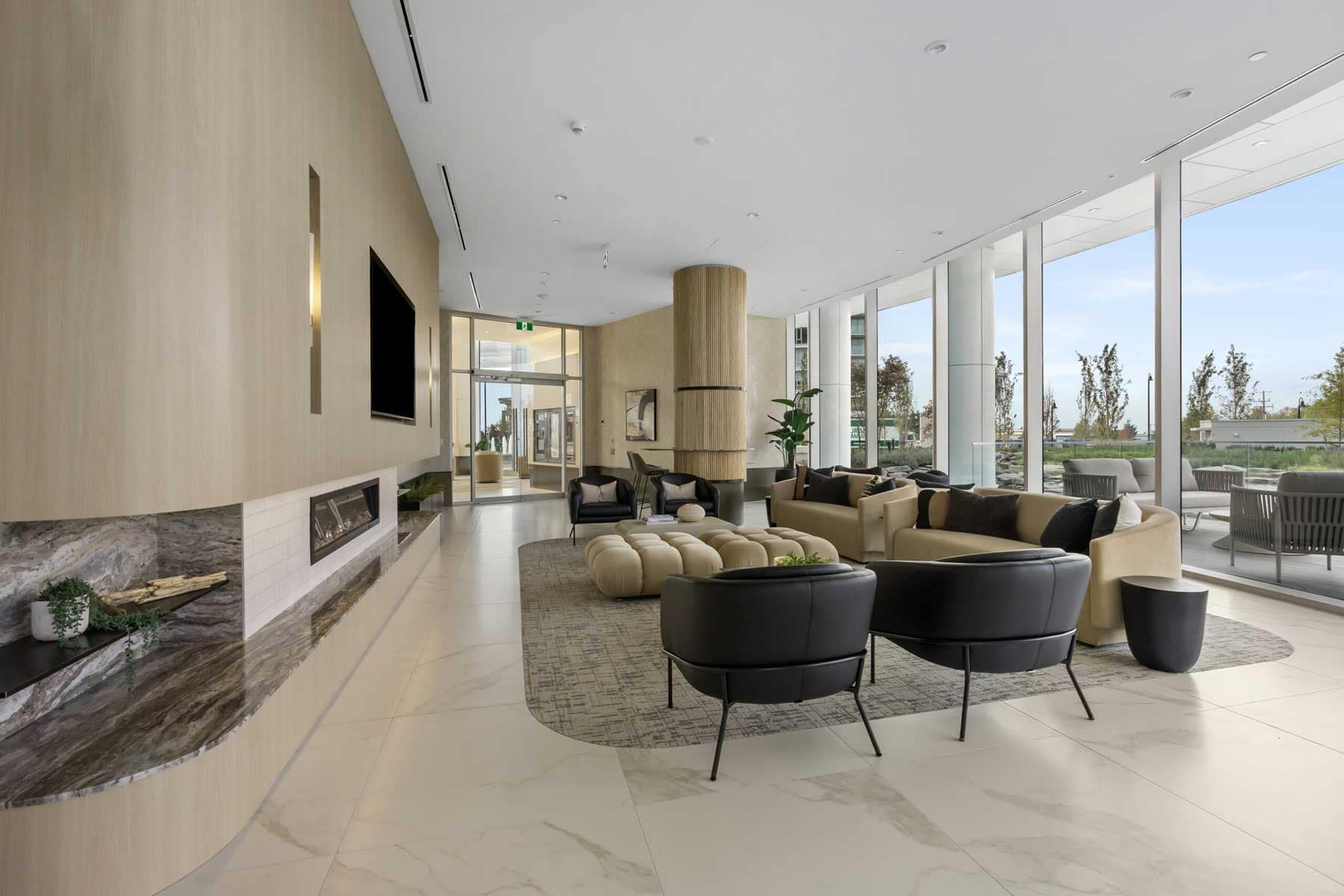 Hotel-inspired fireside lounge at Icon at Southgate City Burnaby featuring comfortable seating, contemporary interiors, and direct access to outdoor amenities.