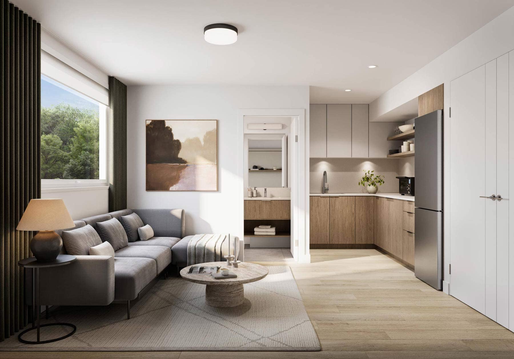 Open-concept living room and kitchen at Nature Haus Fleetwood with modern cabinetry, stainless steel appliances, and bright living space at 16487 89 Avenue Surrey by Isle of Mann Property Group