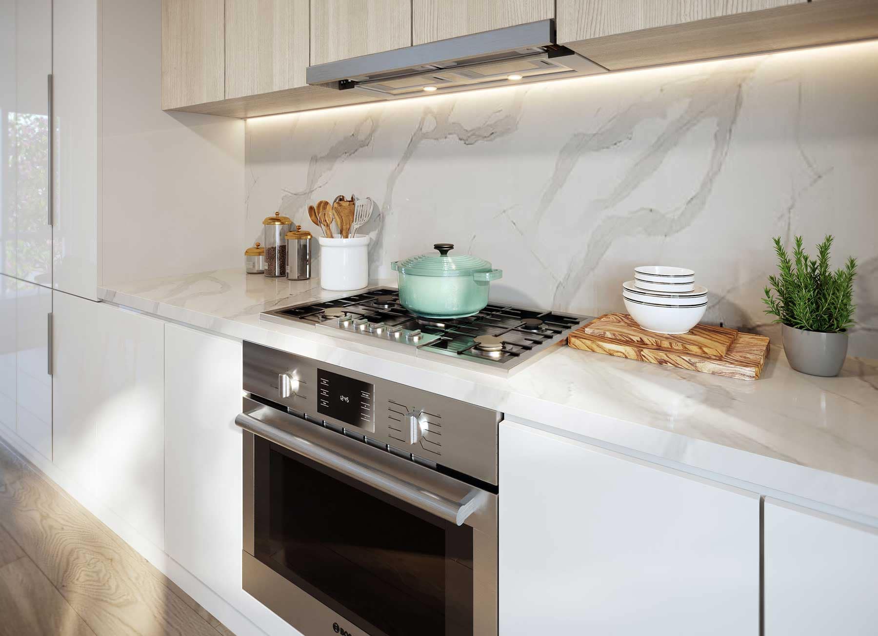 Contemporary designer kitchen at West58 Vancouver by Azora Group at 7425 Granville Street, featuring Bosch appliances, full-height cabinetry, quartz countertops, a marble-inspired backsplash, and premium finishes.