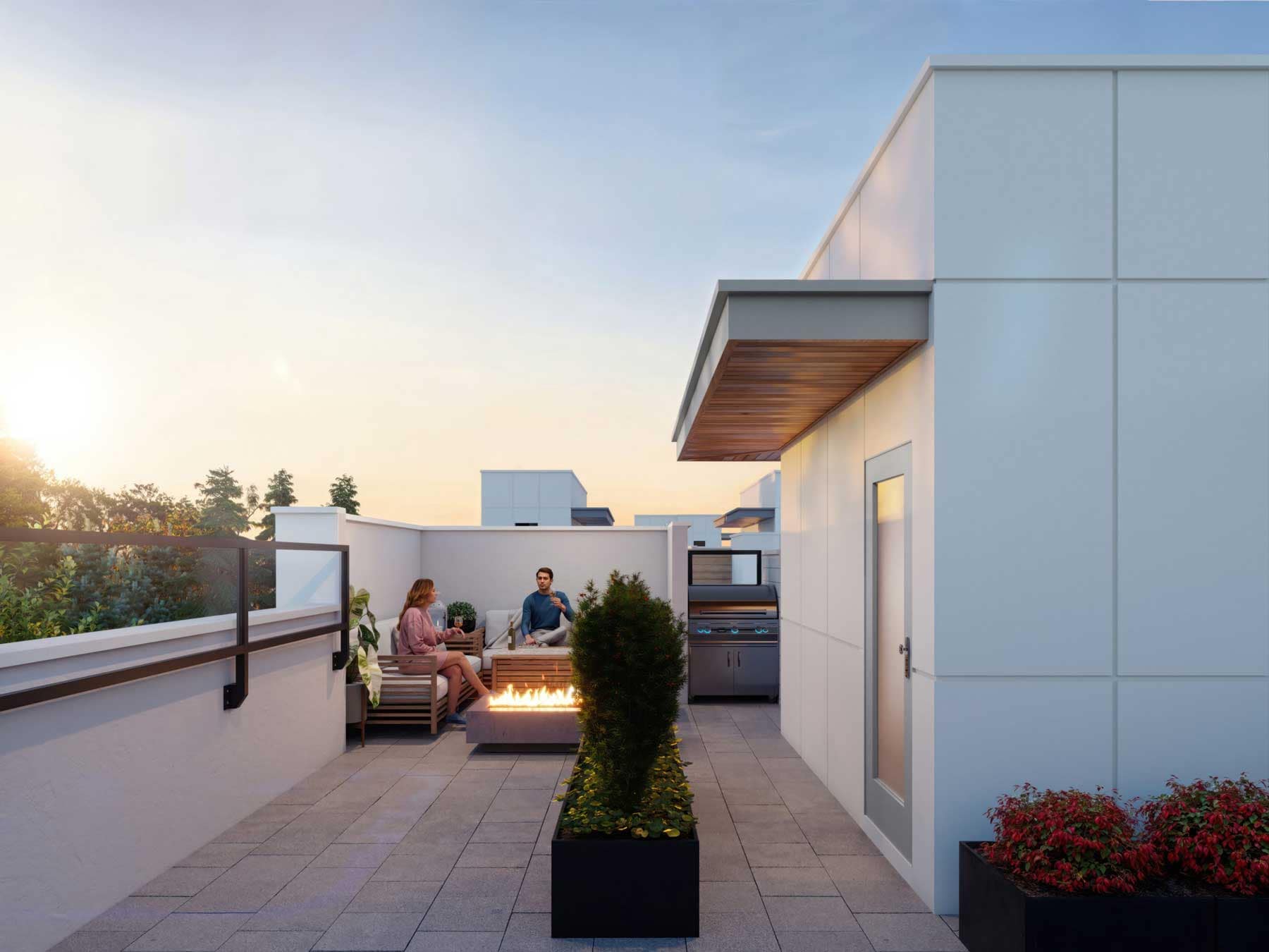 Private rooftop patio at Park Avenue Langley townhomes by Apcon Group featuring outdoor seating, fire table, barbecue area, and open-air entertaining space at 7946 204 Street in Langley.