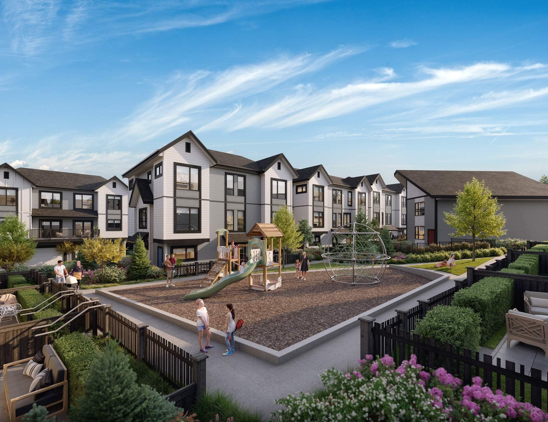 Outdoor playground at Nature Haus Fleetwood with play structures, green space, and surrounding townhomes at 16487 89 Avenue Surrey by Isle of Mann Property Group