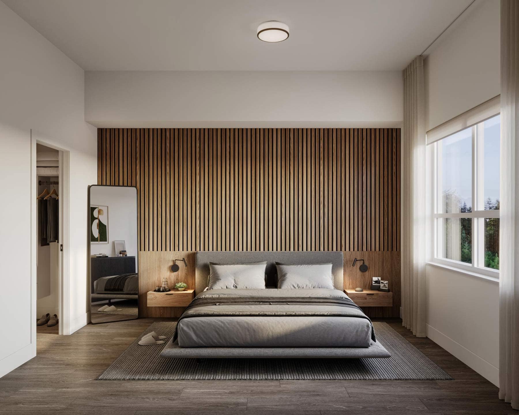 Primary bedroom at Eden Langley with wood accent wall, modern lighting, and spacious layout in Willoughby condo development