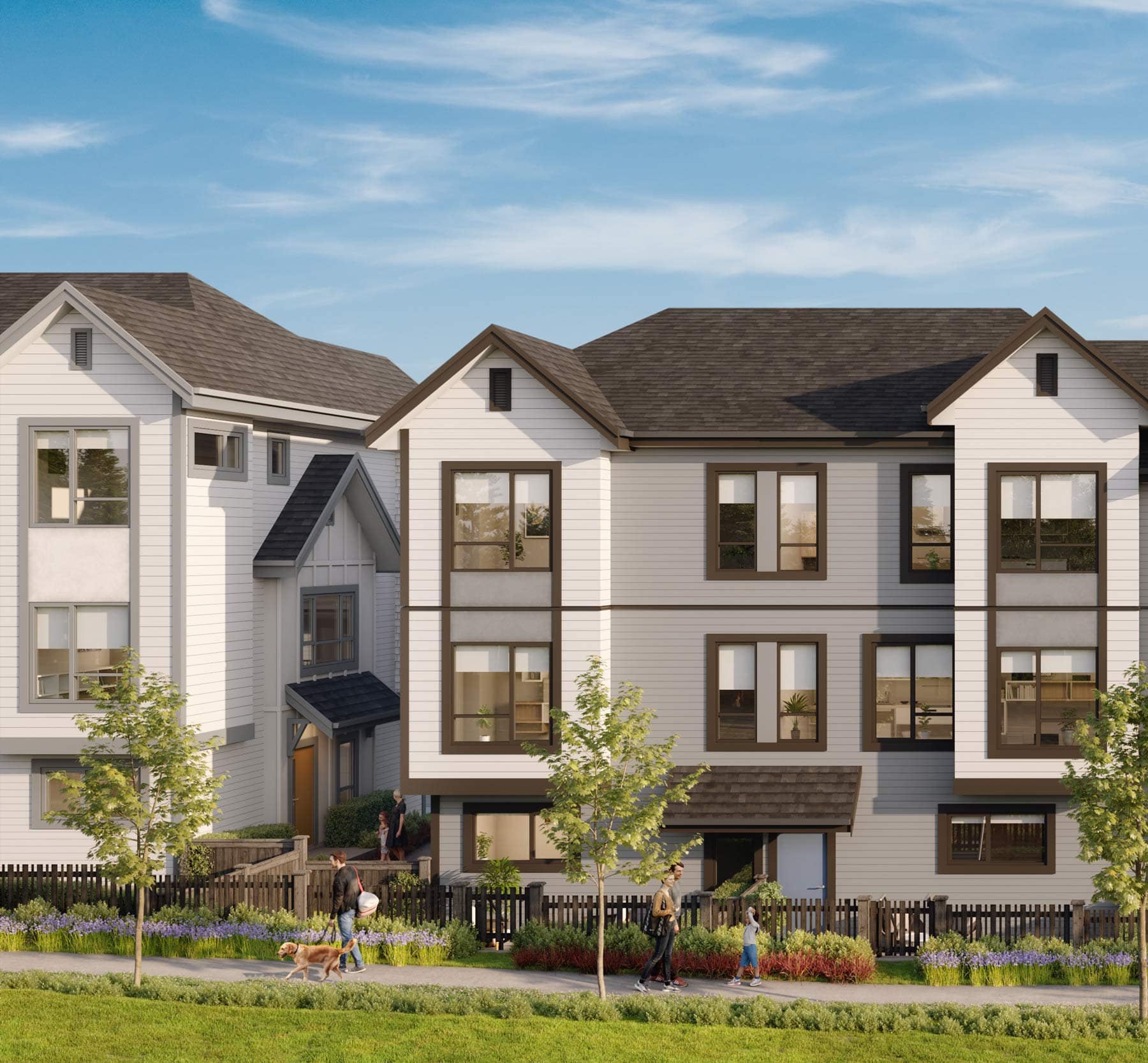 Close-up exterior of Nature Haus Fleetwood townhomes showing modern siding, large windows, and landscaped front yards at 16487 89 Avenue Surrey by Isle of Mann Property Group