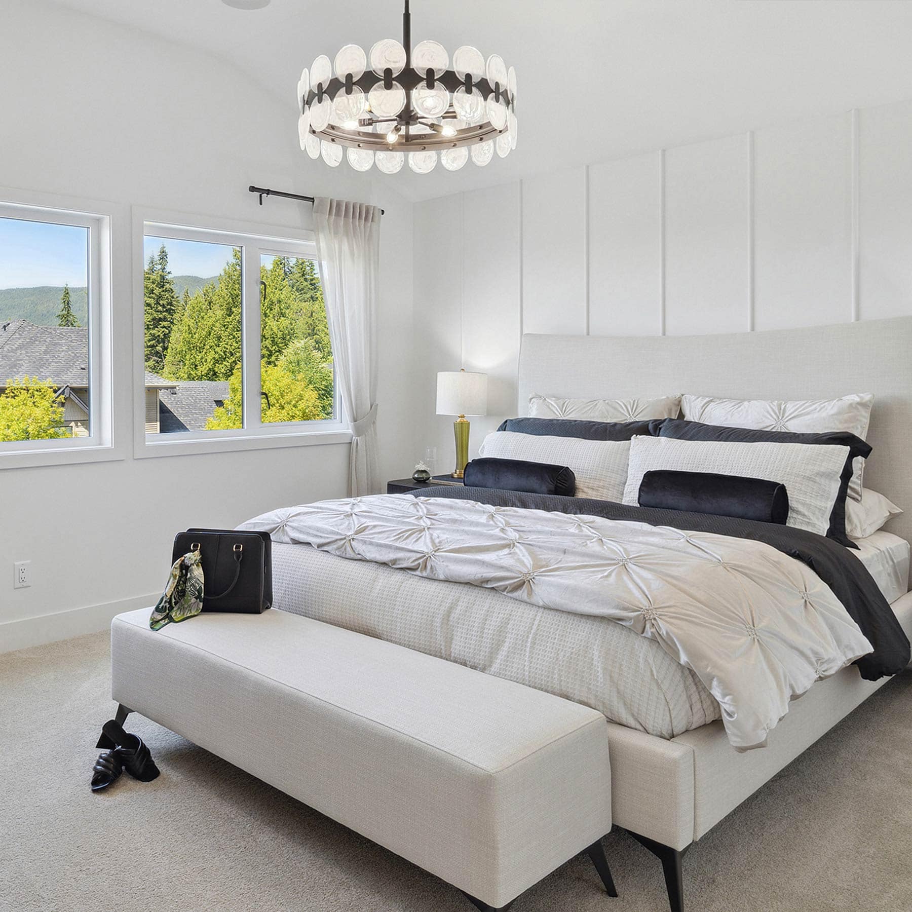 Close-up of kitchen appliances at Timber's Edge Burke Mountain in Coquitlam by Foxridge Homes with gas range, modern cabinetry, and tile backsplash