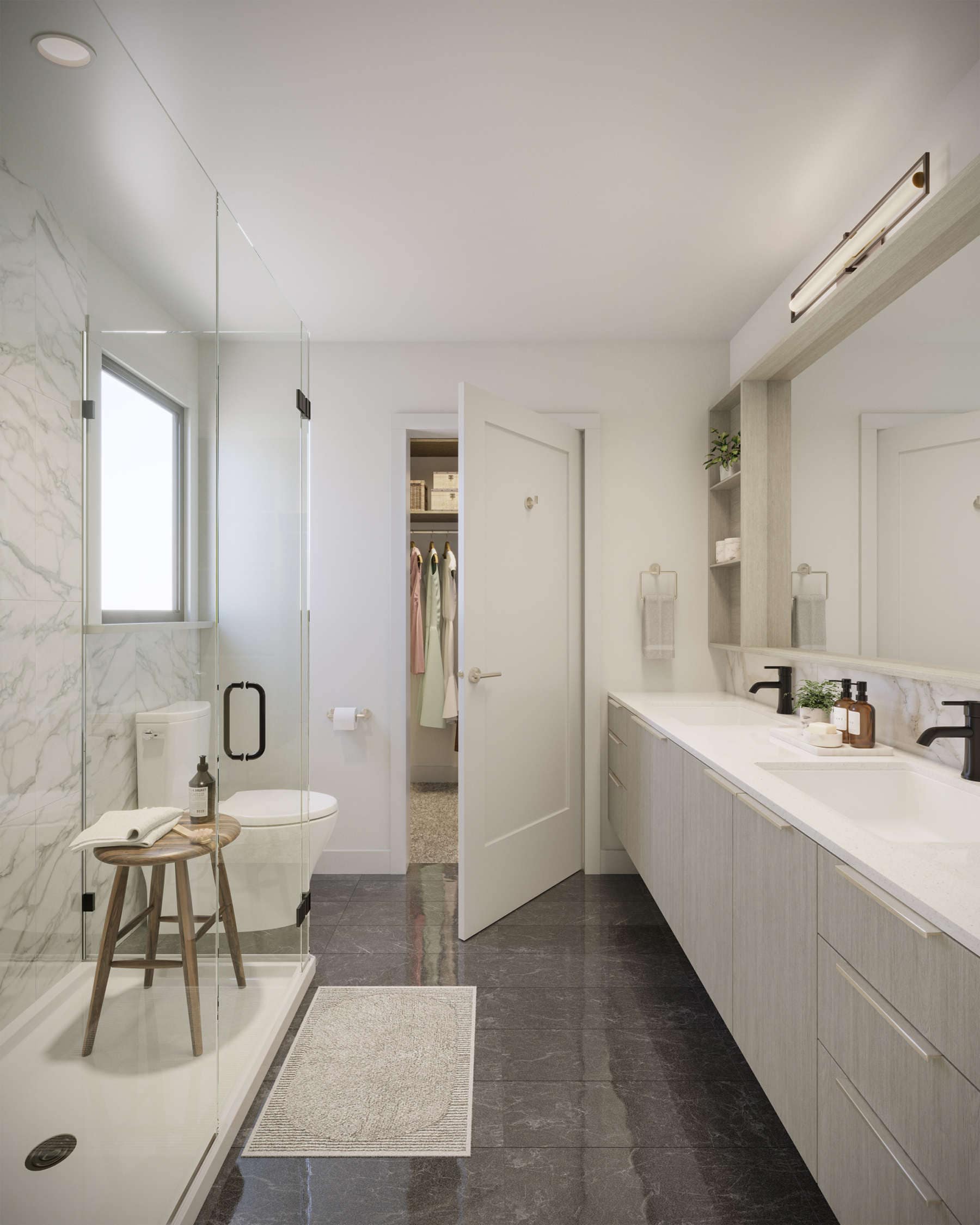 Spacious bathroom at Amson Bloc Surrey by Amson Group featuring double vanity, glass shower, marble tile walls, and modern fixtures located at 5937 144 Street Panorama Ridge Surrey