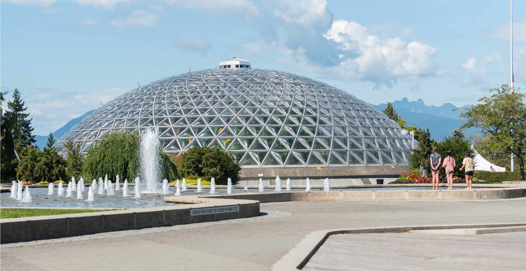 WesBloedel Conservatory near West58 Vancouver with its iconic glass dome, fountains, and mountain views, located a short drive from 7425 Granville Street.