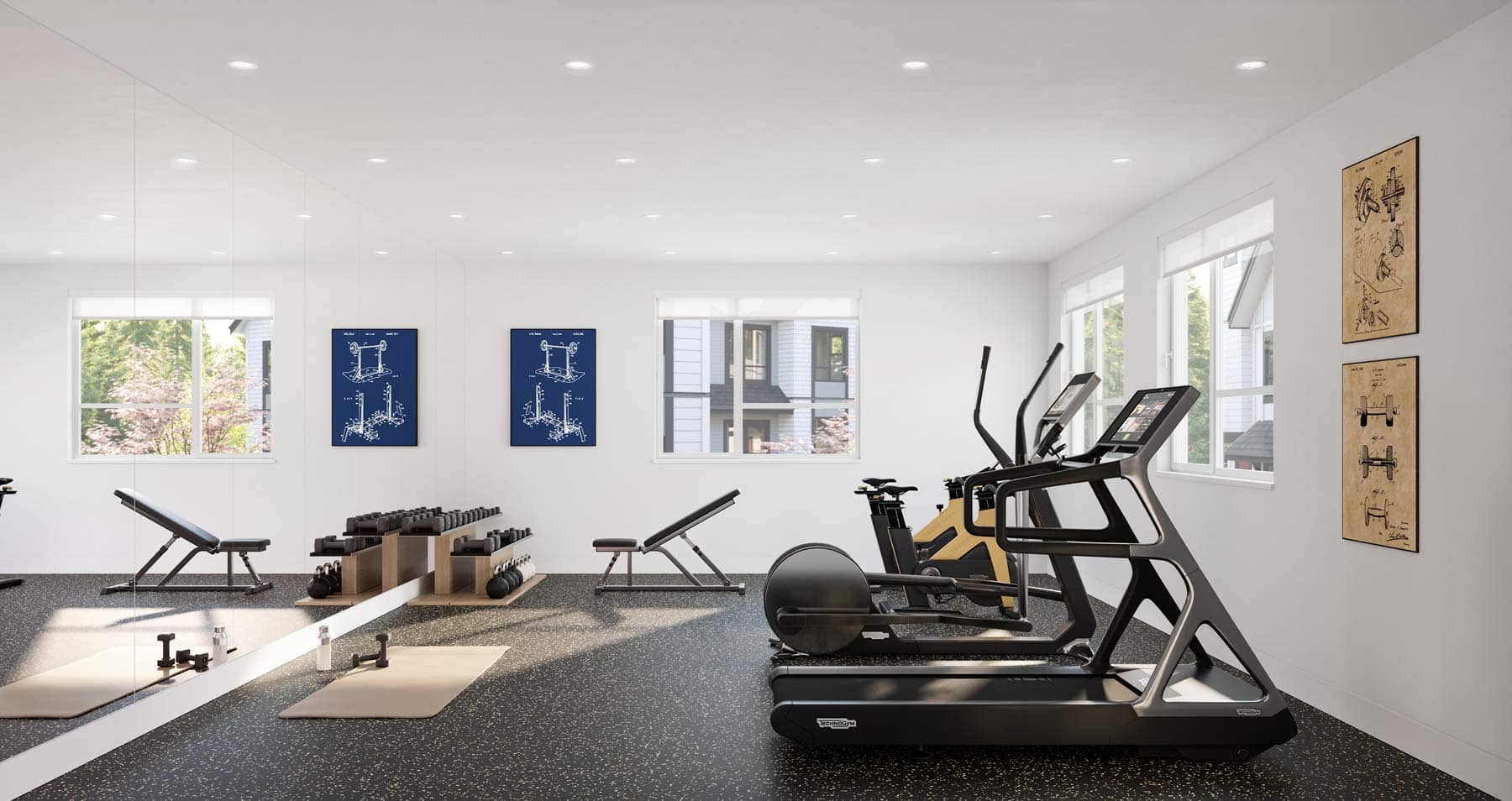 Fitness room at Nature Haus Fleetwood with treadmills, weights, and modern gym equipment at 16487 89 Avenue Surrey by Isle of Mann Property Group