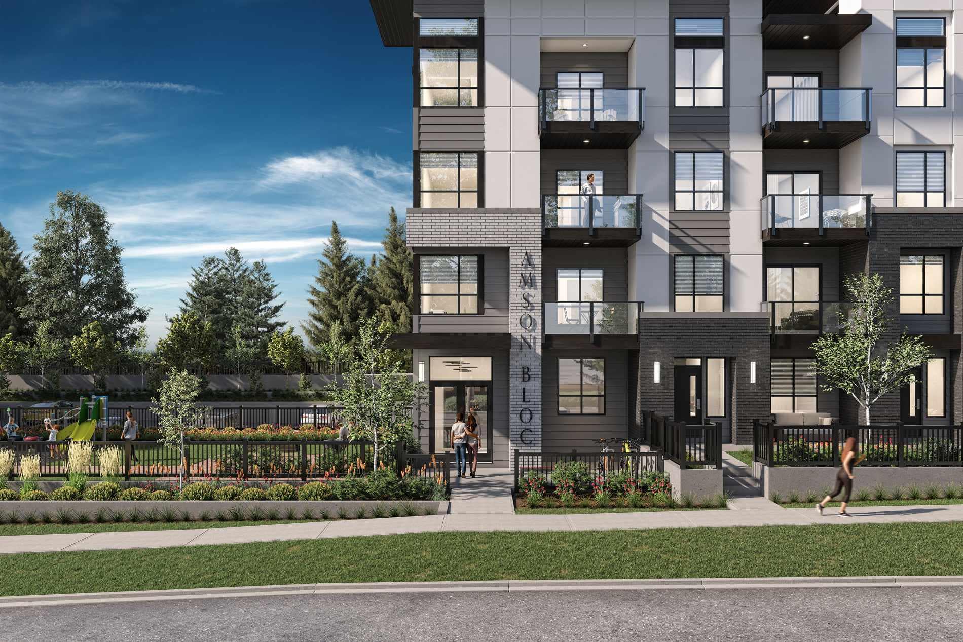 Front entrance of Amson Bloc Surrey by Amson Group featuring modern architecture, landscaped courtyard, pedestrian pathways, and residential entry at 5937 144 Street in Panorama Ridge Surrey