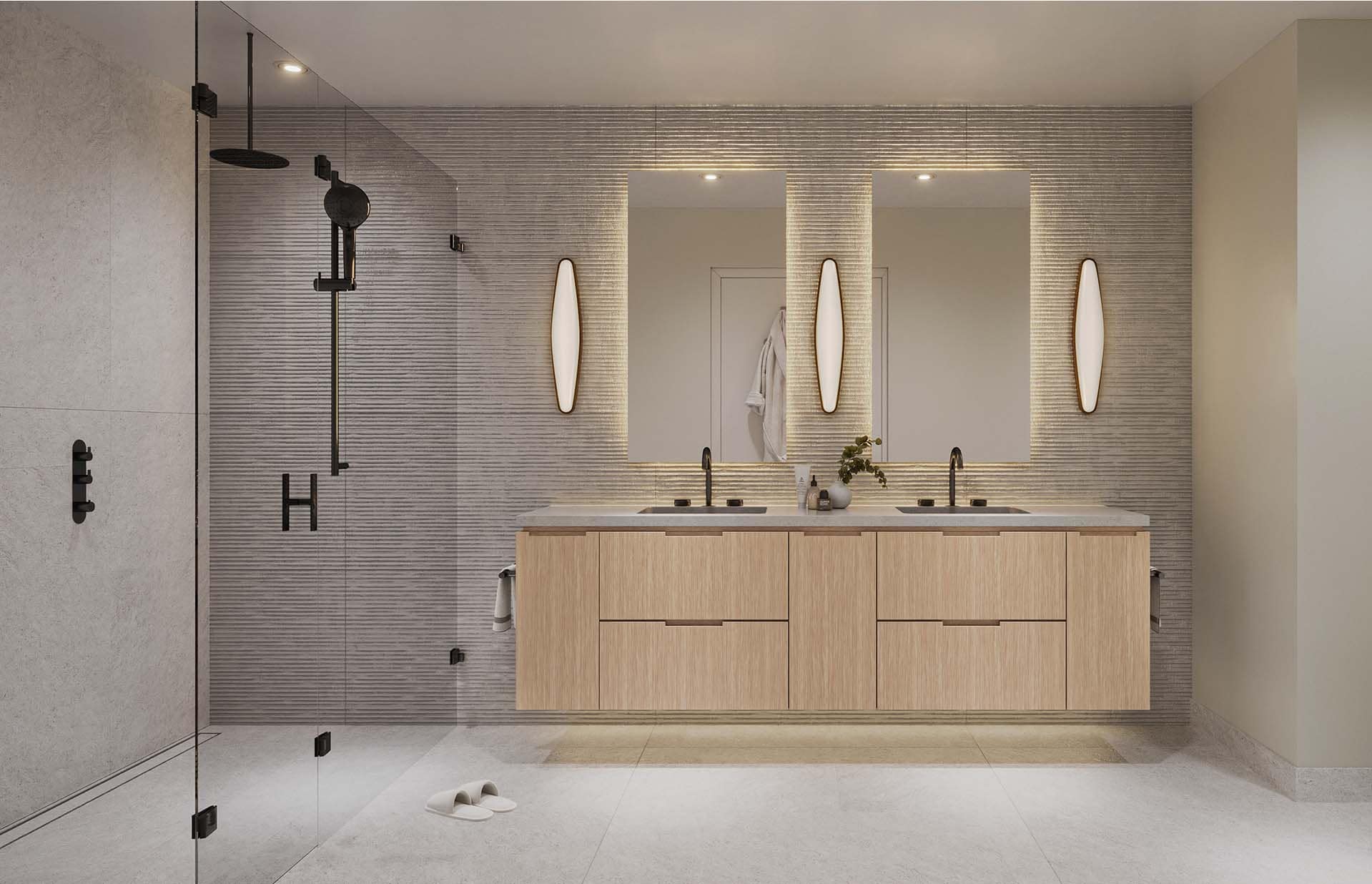 Primary bathroom at Nolia Vancouver with light wood vanity and glass shower
