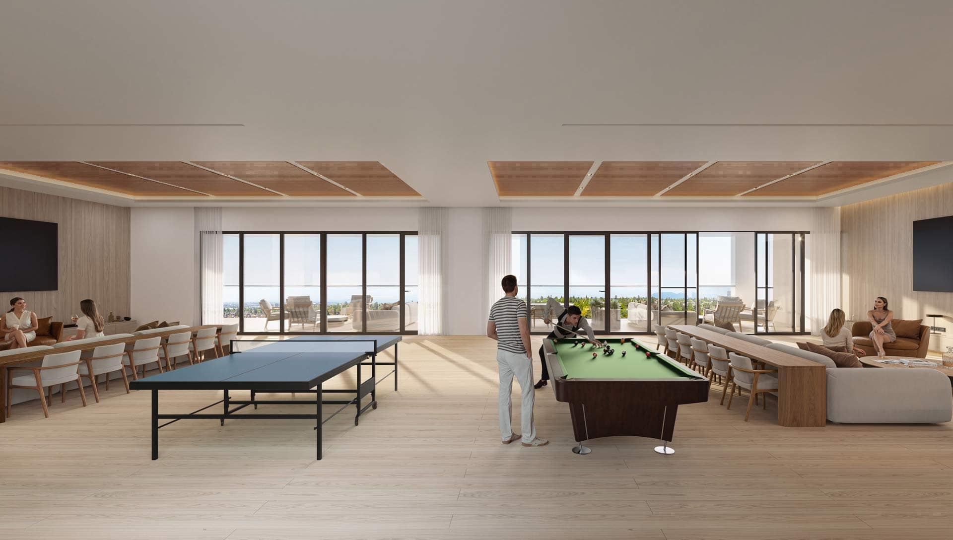 Indoor amenity lounge at West 57th Vancouver by Onni Group at 500 West 57th Avenue in Cambie, featuring billiards, ping pong, seating areas, and large windows opening to outdoor terrace space