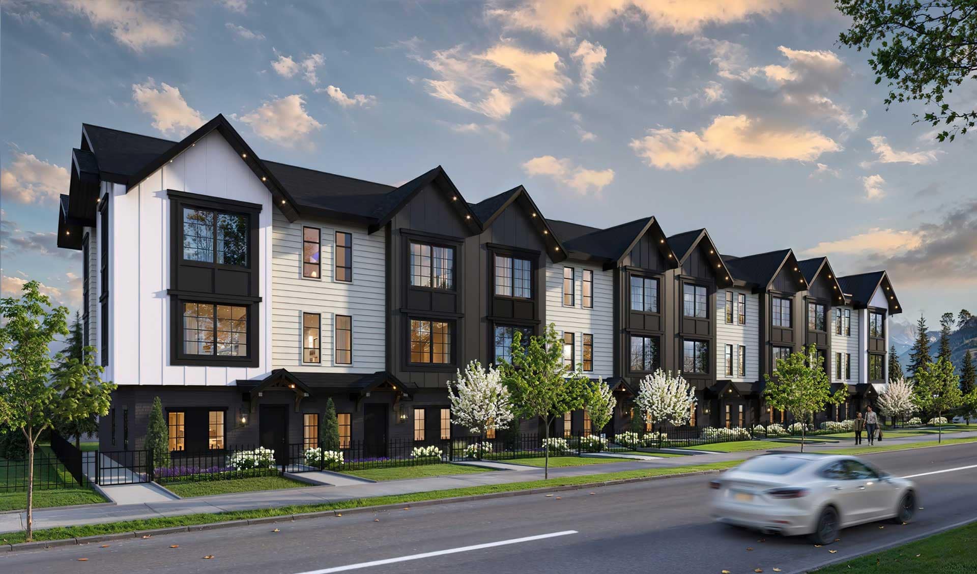 Bromley Langley presale townhomes in Brookswood by Leone Homes at 20815 45A Avenue featuring a row of modern farmhouse-style three-storey homes with black and white exteriors, pitched roofs, large windows, landscaped front yards, and a tree-lined street setting in Langley