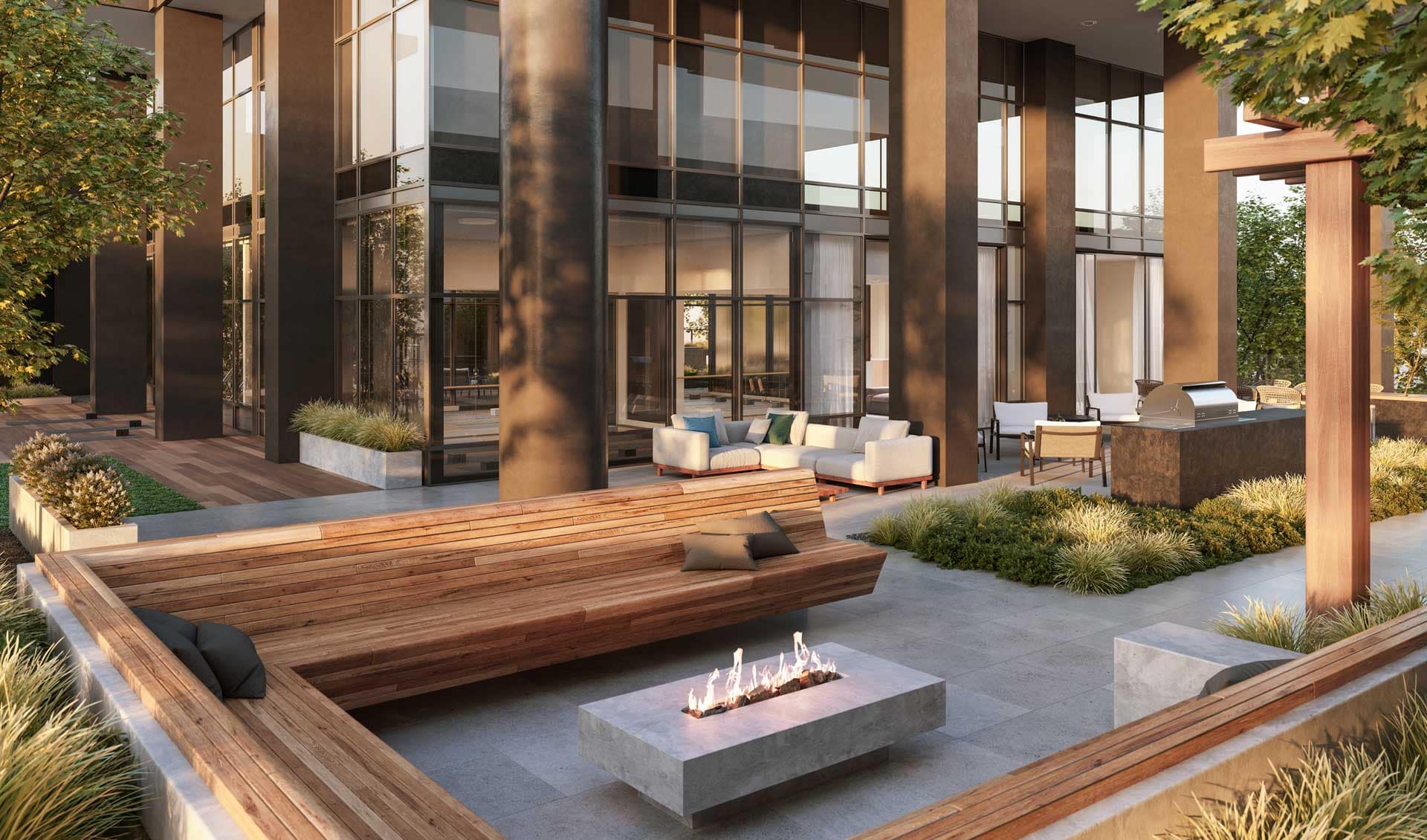 Outdoor lounge at Jinju Coquitlam by Anthem Properties in Burquitlam, 533 Cottonwood Avenue, featuring fire pit, seating, greenery, and modern outdoor design.