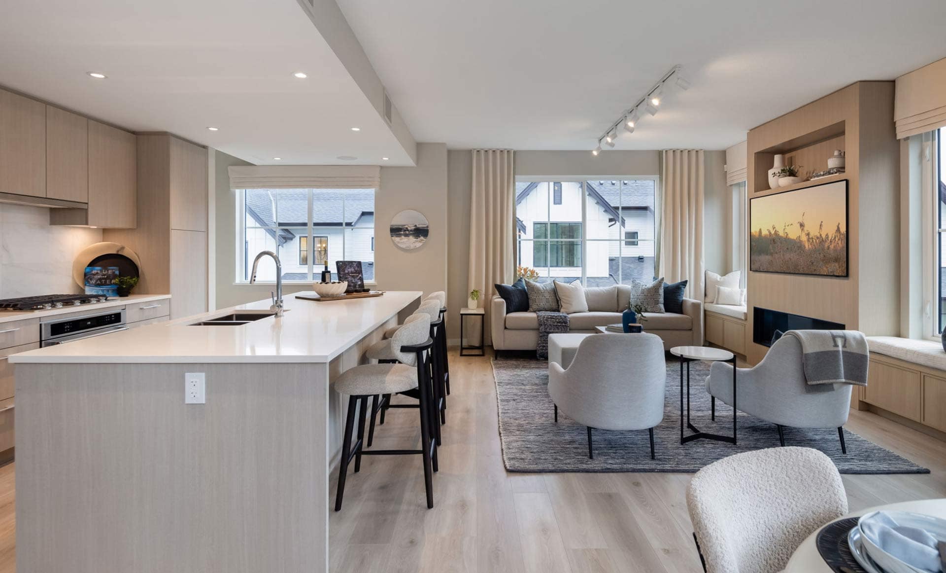 Open-concept kitchen and living area at Ridgewood Burke Mountain by Polygon featuring a large island, modern cabinetry, and bright windows at 3637 Sheffield Avenue Coquitlam.