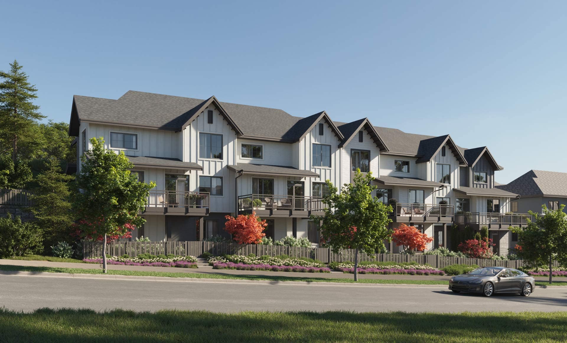 Exterior view of Ridgewood Burke Mountain townhomes by Polygon at 3637 Sheffield Avenue in Coquitlam, showing modern gabled architecture, landscaped frontage, and street-level perspective