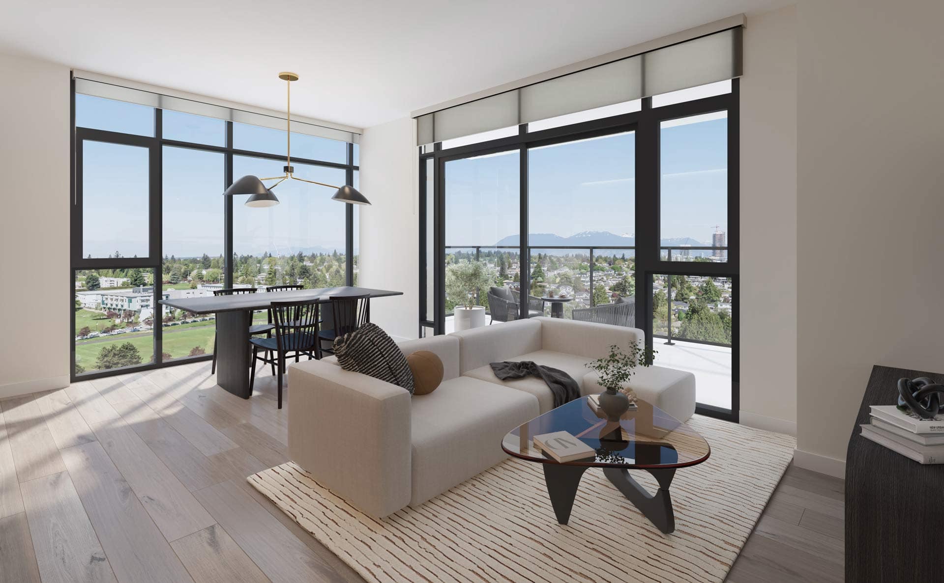 Open living and dining space at West 57th Vancouver by Onni Group at 500 West 57th Avenue in Cambie, featuring large windows, balcony, and views of city and mountains