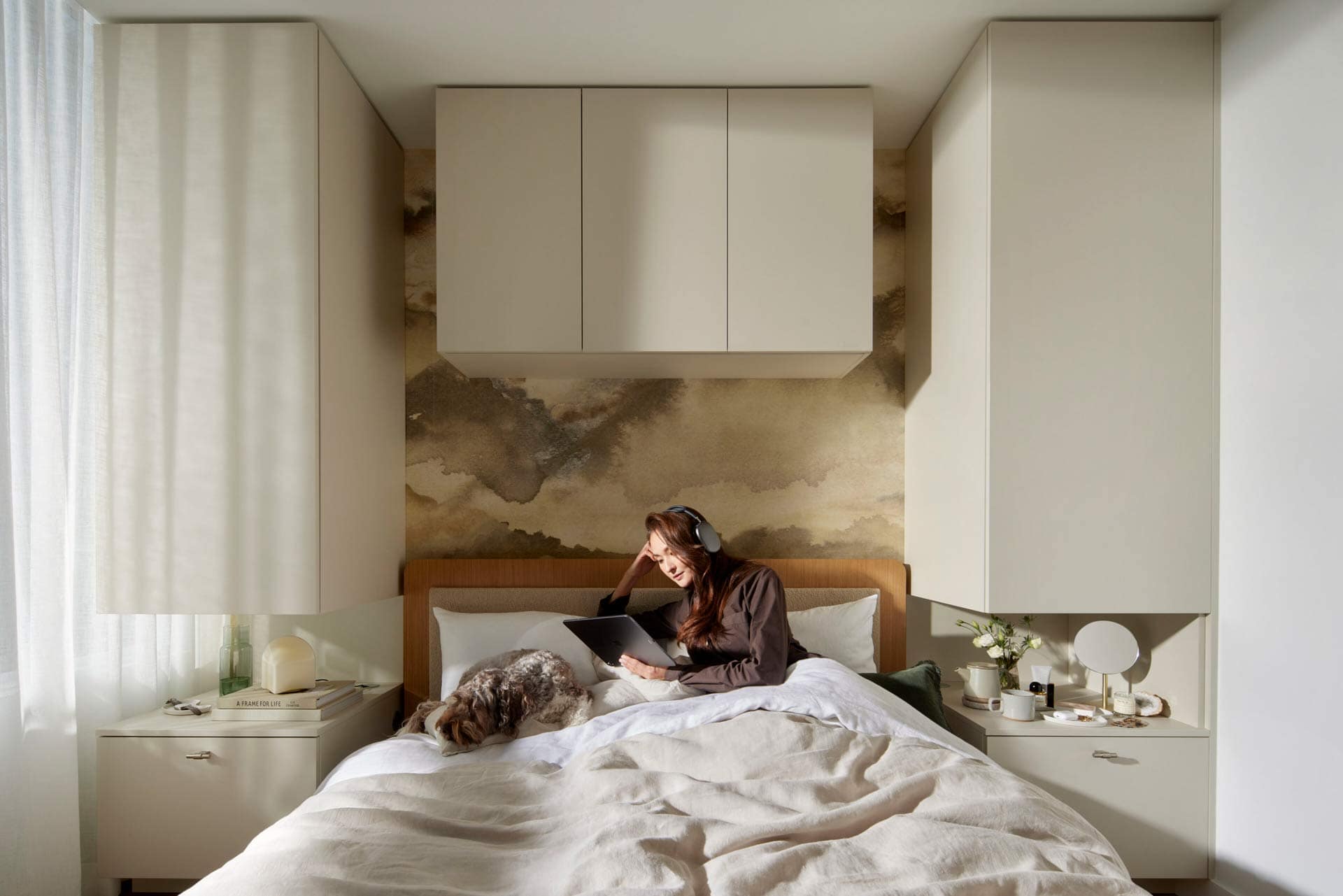 Bedroom with workspace at Town & Centre by Mosaic at 3650 Westwood Street featuring built-in cabinetry and cozy layout in Coquitlam Town Centre