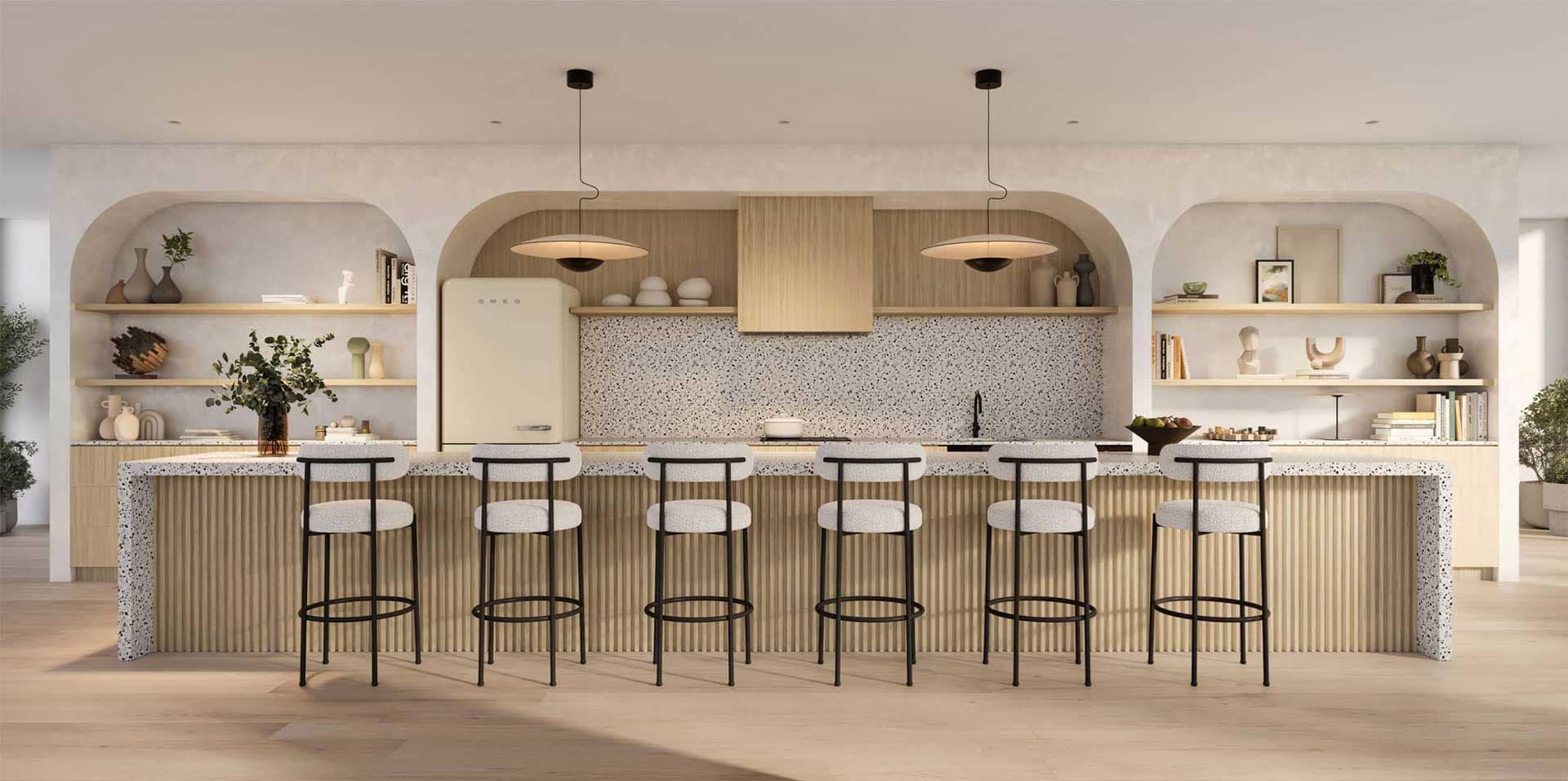 Shared amenity kitchen at 1 Market Square Port Moody by Wesgroup at 220 Guildford Drive, featuring long island seating, custom millwork, open shelving, and modern finishes designed for gatherings in Port Moody North Shore.