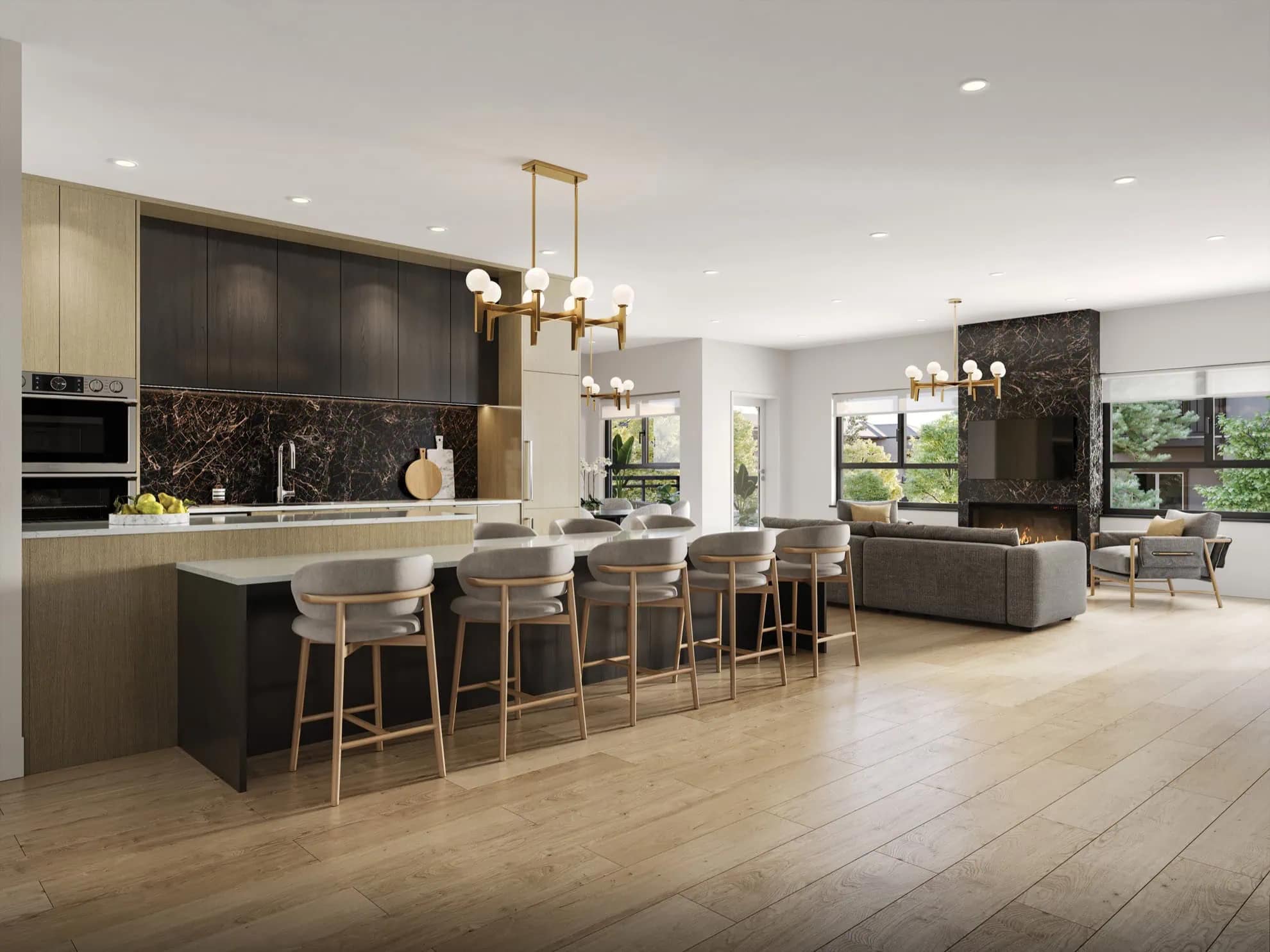 Amenity lounge at The PoCo Port Coquitlam featuring a large shared kitchen, bar seating, modern lighting fixtures, and open gathering space designed by Azure Group at 2431 Mary Hill Road