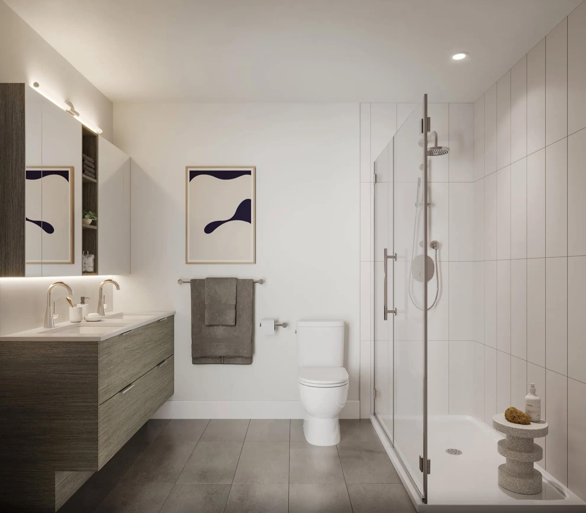 Modern bathroom interior at The PoCo Port Coquitlam featuring a floating vanity, glass-enclosed shower, large-format tile flooring, and clean contemporary finishes designed by Azure Group at 2431 Mary Hill Road