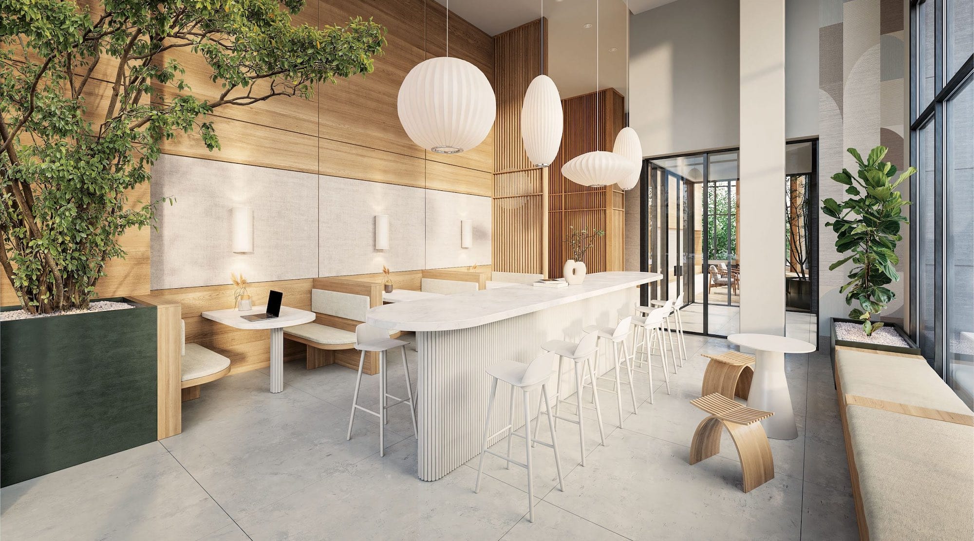 Interior lobby lounge at Soco Two Coquitlam presale condos by Anthem located at 311 Alderson Ave in Coquitlam’s Maillardville neighbourhood featuring a modern social workspace with bar seating