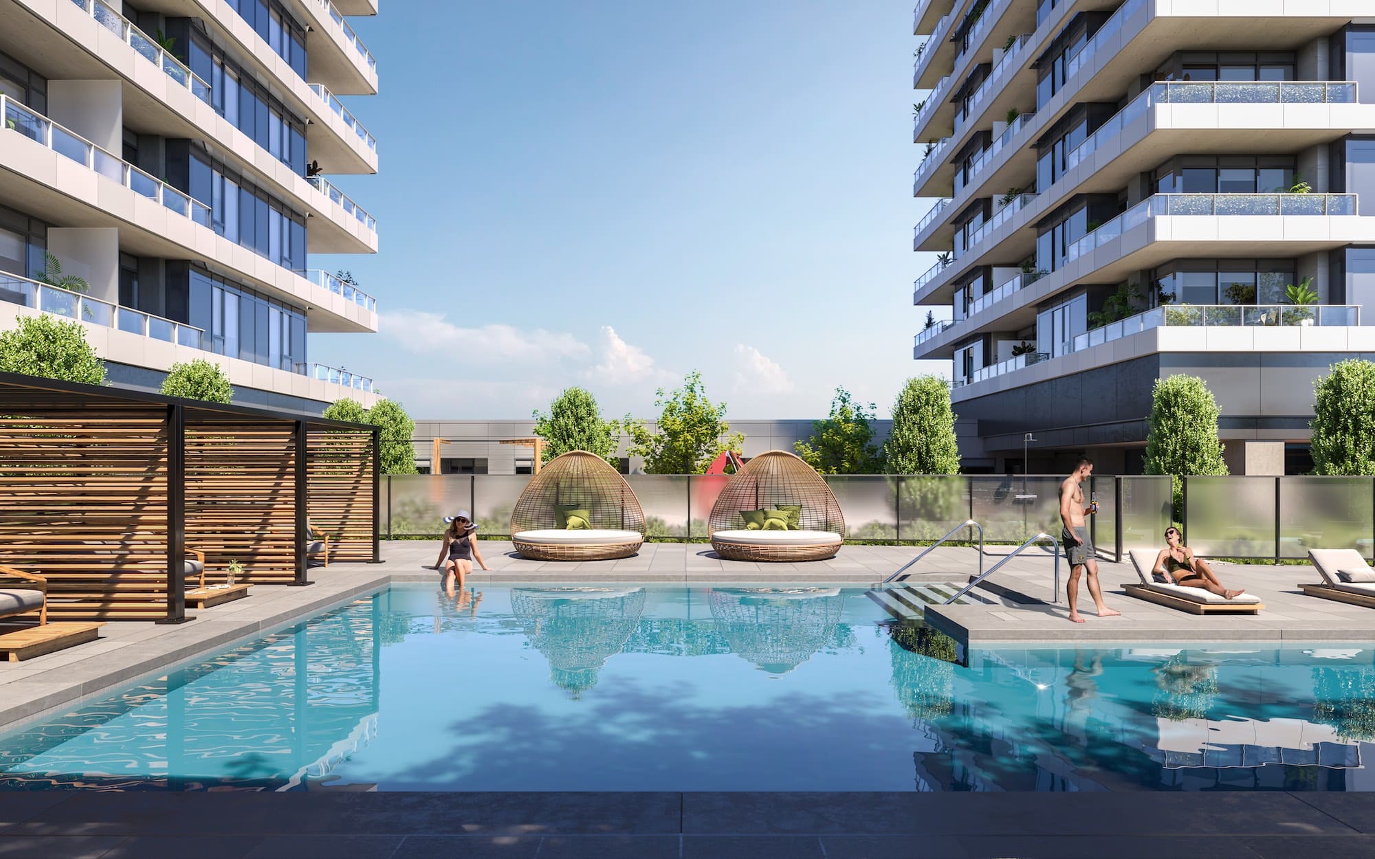 Outdoor pool terrace at Band Coquitlam with loungers and cabanas