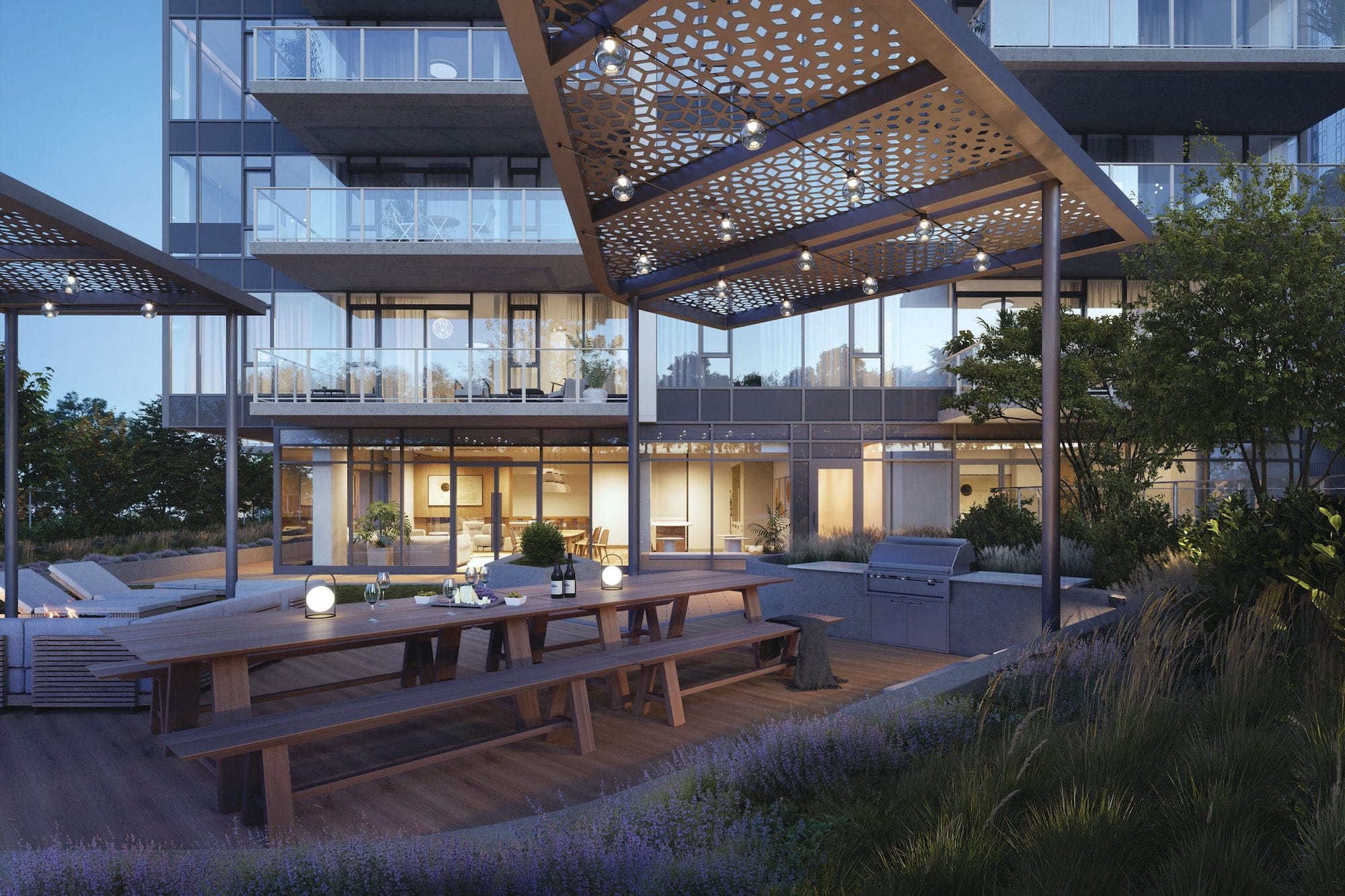 Outdoor amenity courtyard at Soco Two Coquitlam presale development by Anthem located at 311 Alderson Ave in Coquitlam’s Maillardville neighbourhood featuring communal dining tables
