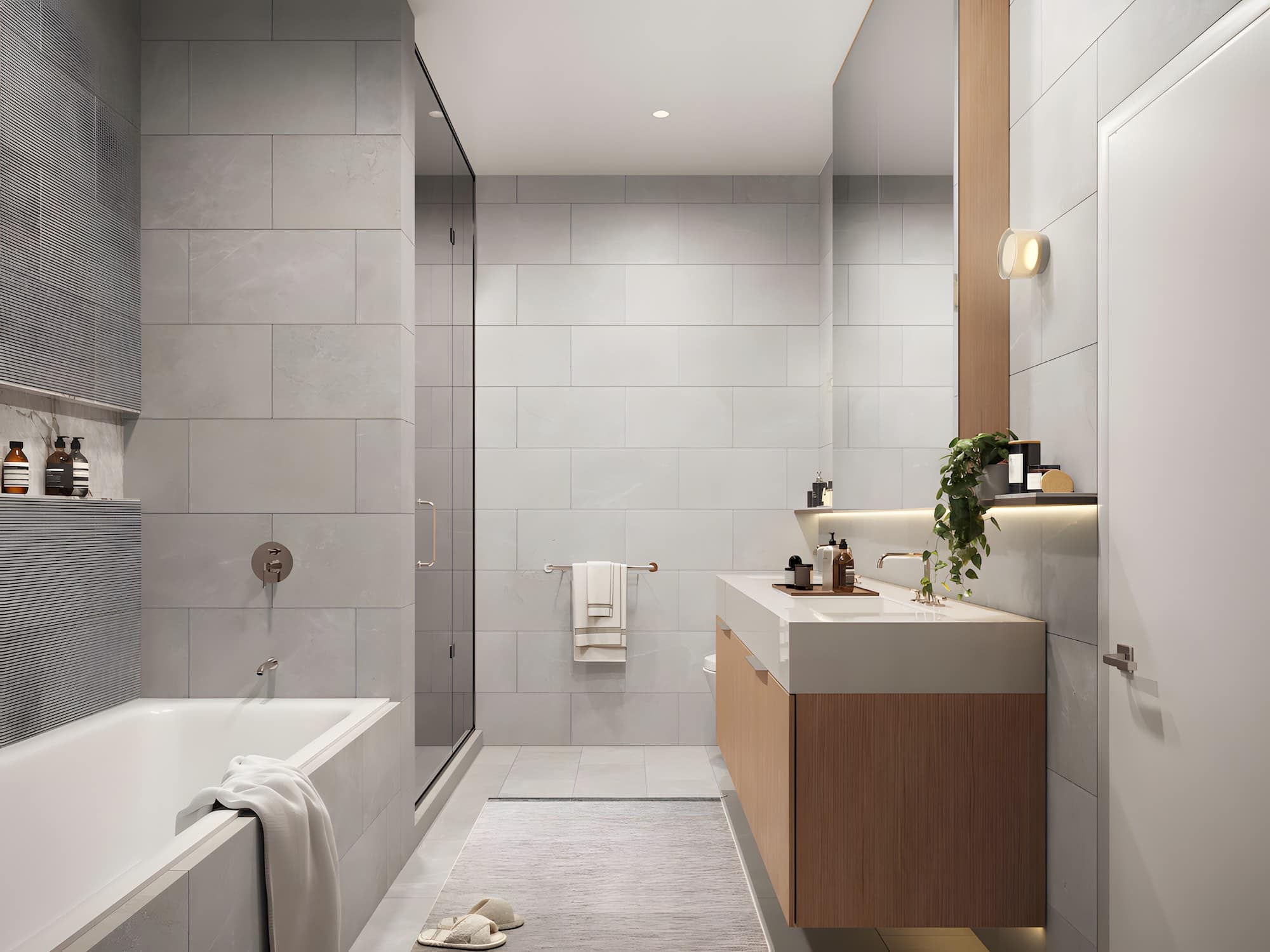 Modern light bathroom with vanity and tub at Ashleigh Oakridge Vancouver.