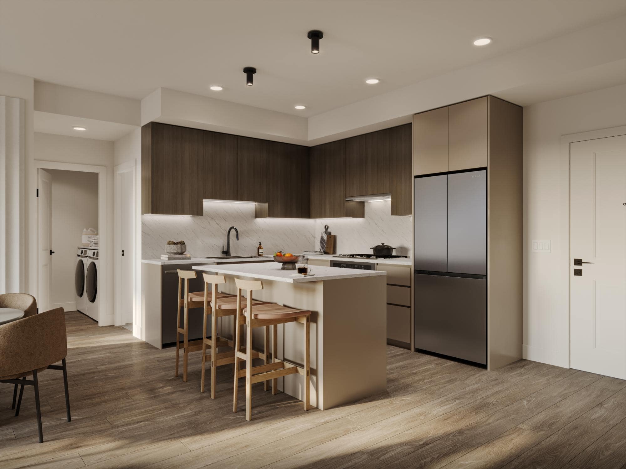 Contemporary kitchen at Eden Langley featuring island seating, integrated appliances, and wood cabinetry in Willoughby condo development