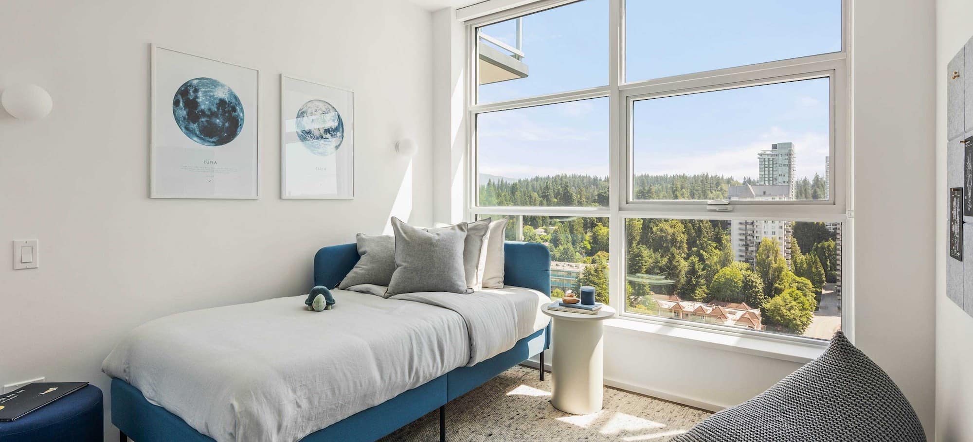 Bedroom with city and forest views at The City of Lougheed Burnaby condos