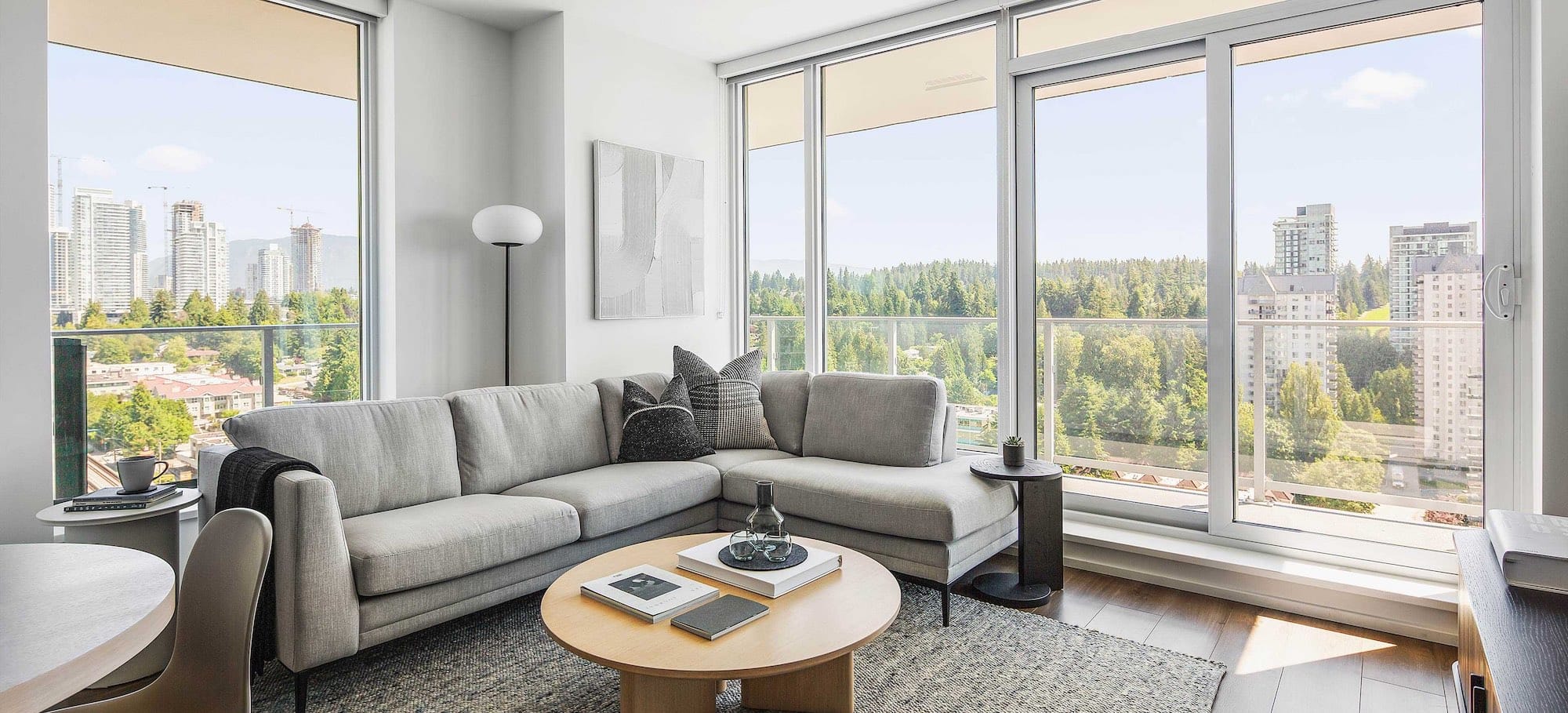 Living room with floor-to-ceiling windows at The City of Lougheed Burnaby