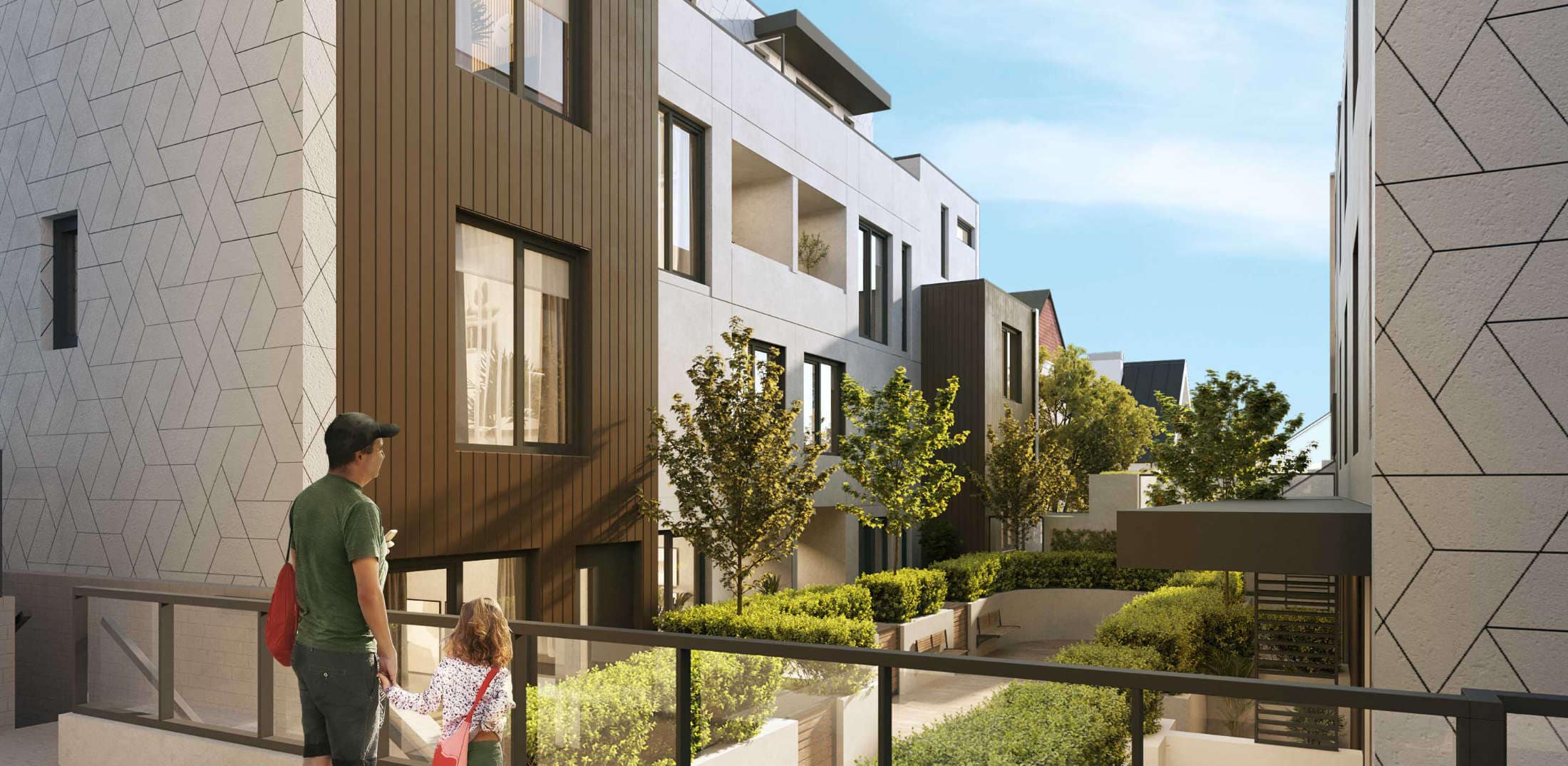 Landscaped courtyard and pedestrian walkway at Lakewood presale development by Dimex Group in Vancouverโs Grandview neighbourhood, featuring greenery, modern building faรงades, and shared outdoor spaces at 2057 East 1st Avenue.