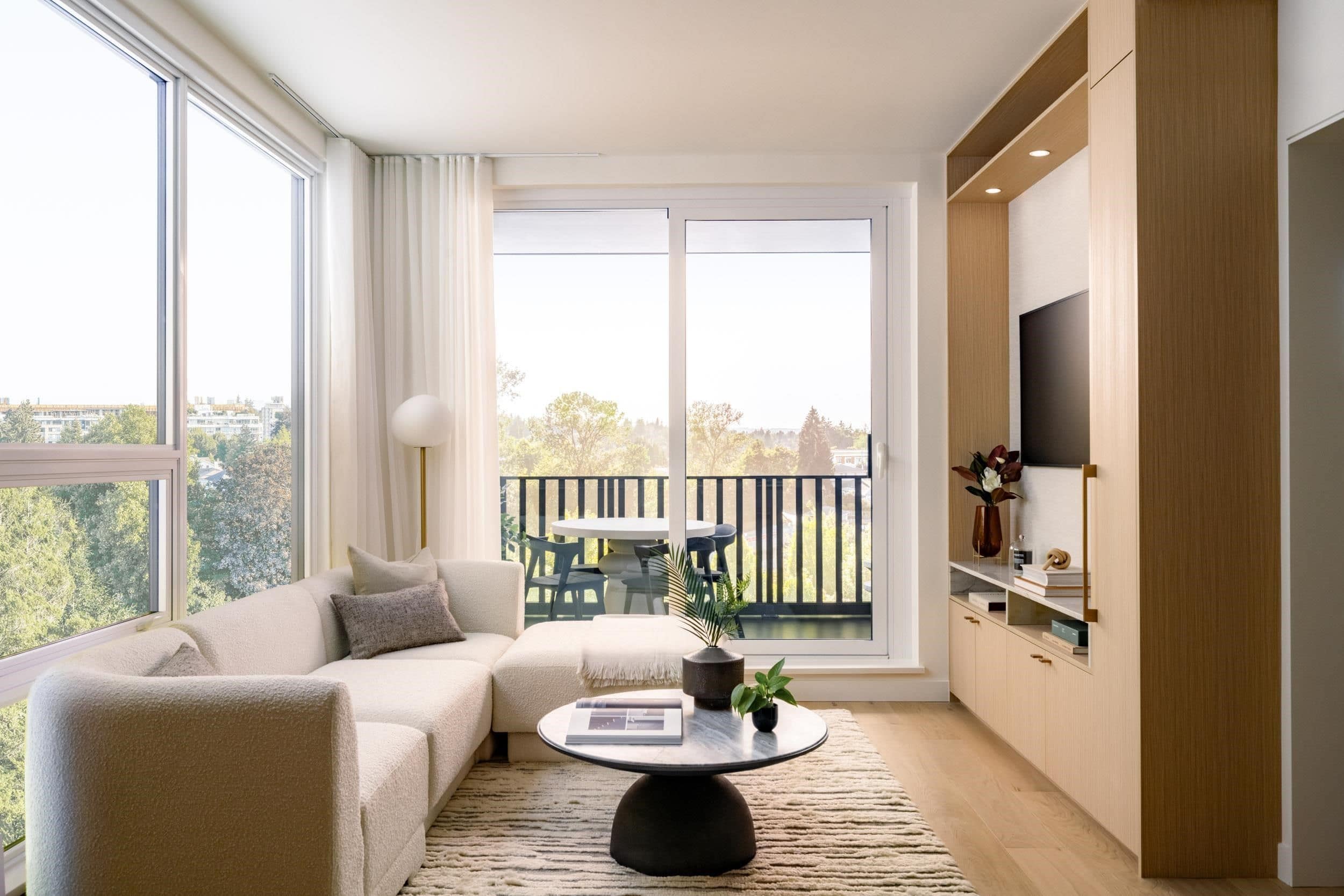 living room with built-in media wall and balcony at Ashleigh Oakridge Vancouver